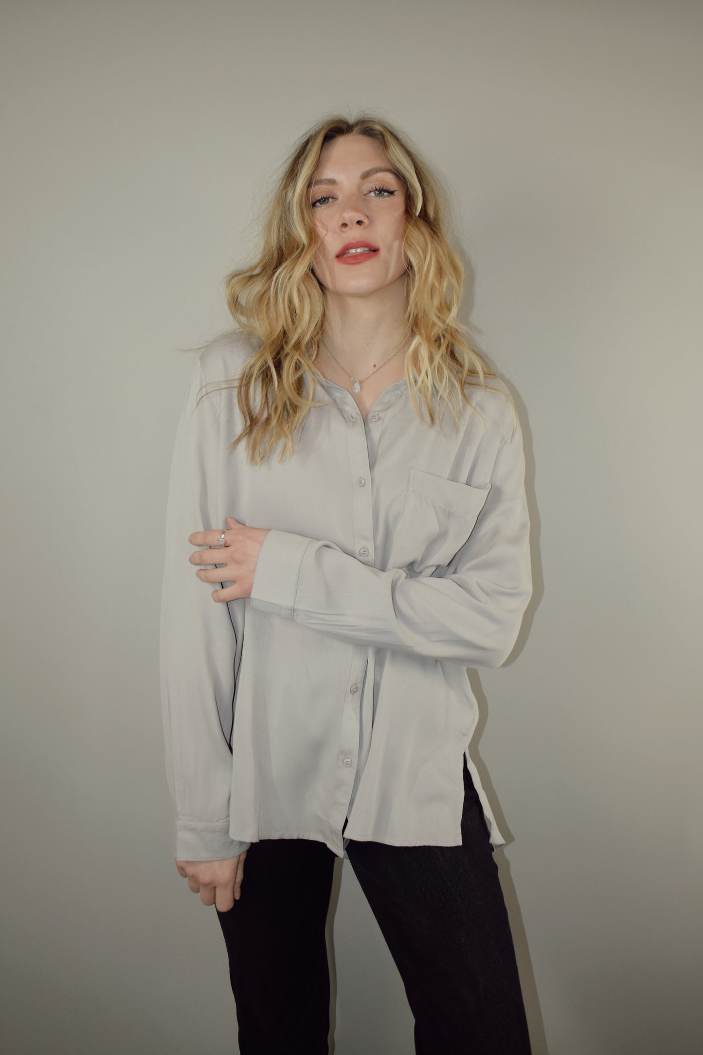 long sleeve full length button down with one patch breast pocket slits along sides on hem 