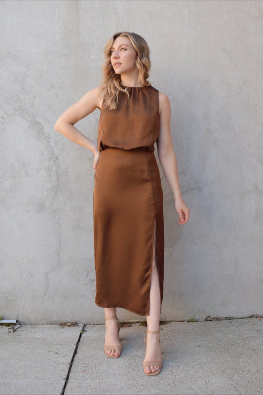satin bronze midi dress with front side slit fitted waist sleeveless pleated back detail on bodice high neck