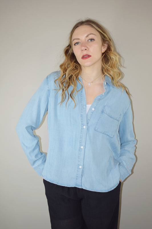 Tencel light wash denim long sleeve button down with one breast patch pocket full length