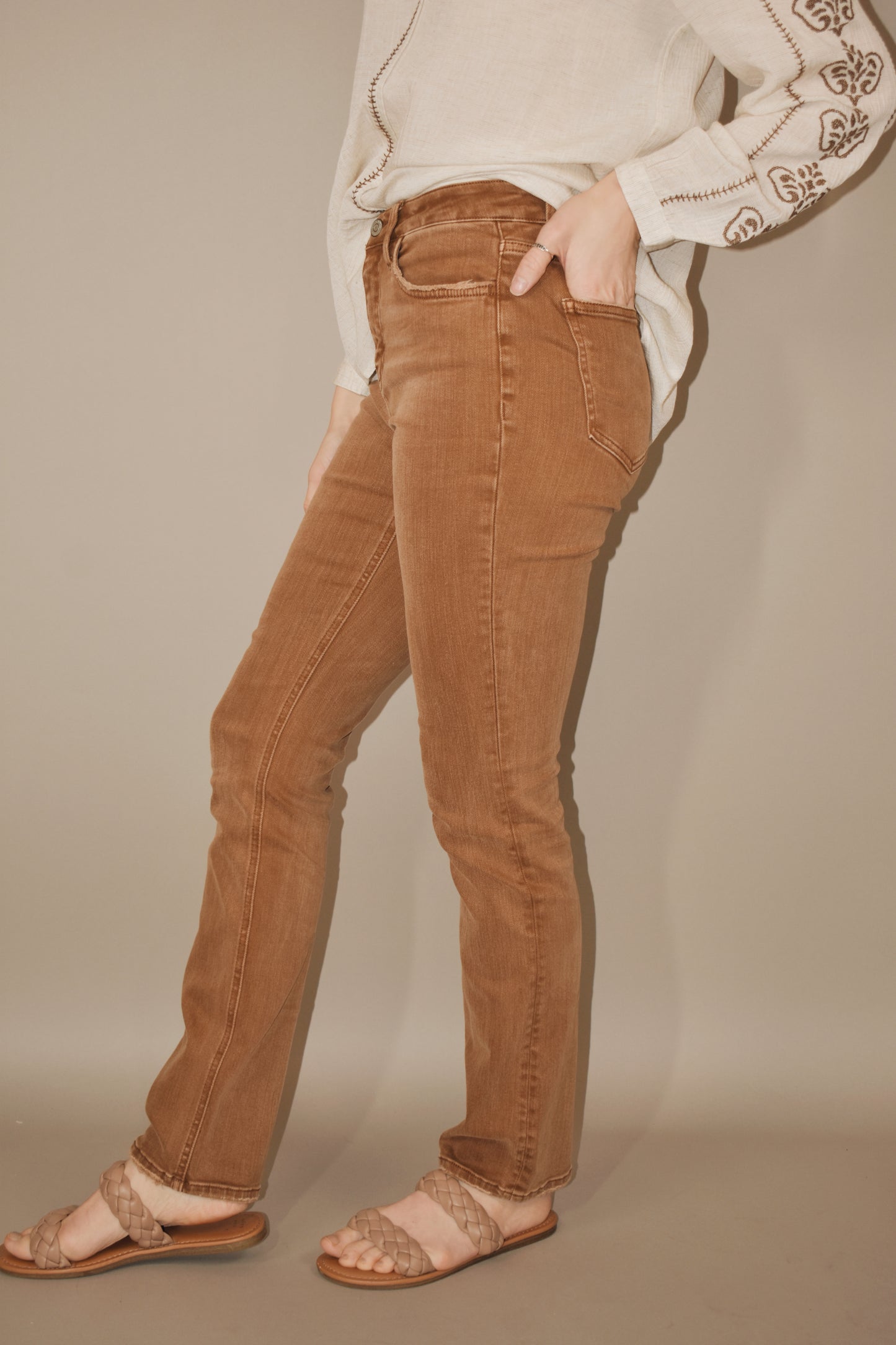 Toffee colored denim. Stretch denim. High waisted. Slim straight leg, full length. No holes or distressing. Zip and button enclosure. 