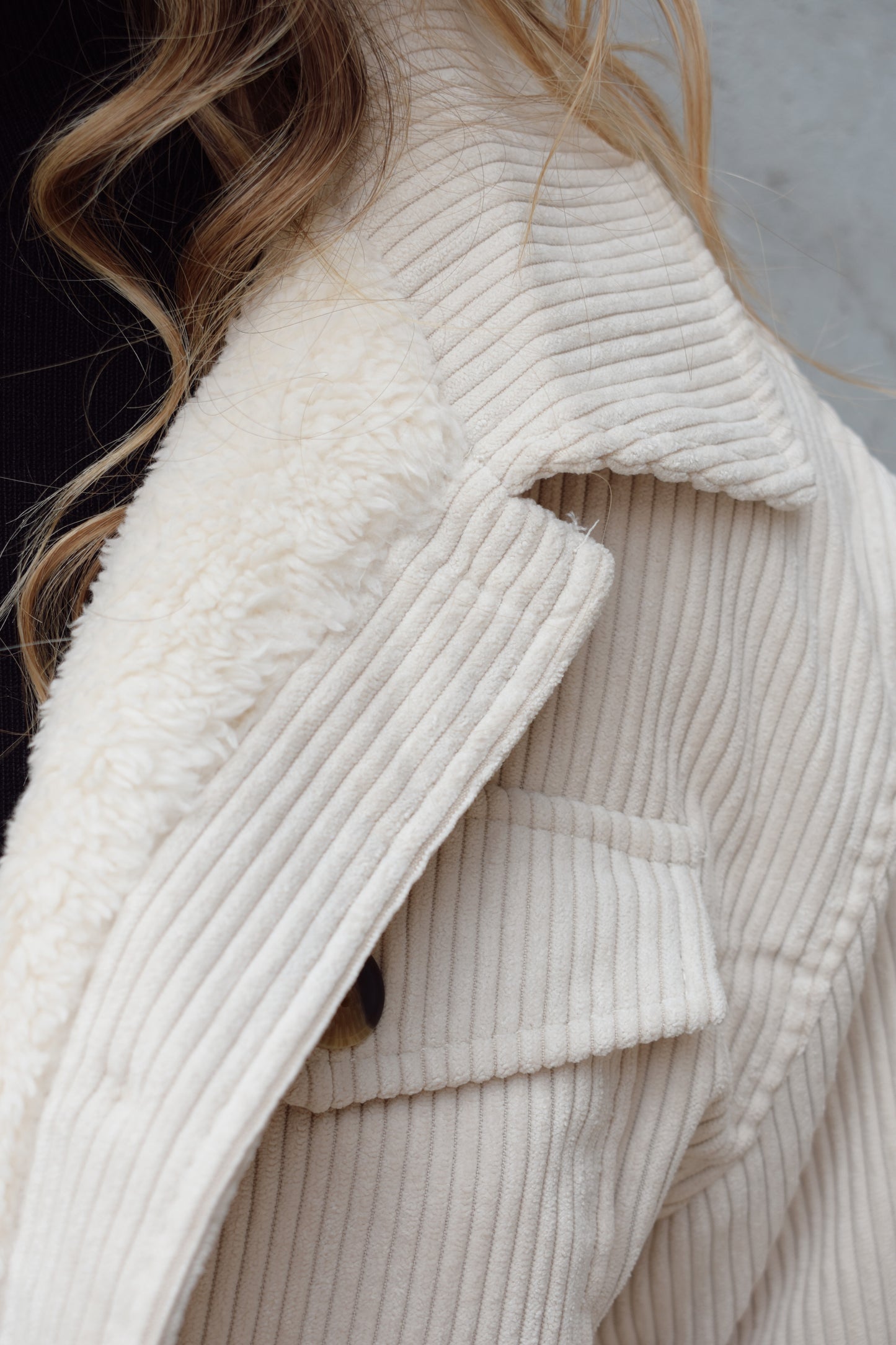 corduroy button down shacket, fur lined, has side pockets, patch breast pockets with fold and button enclosure, full length