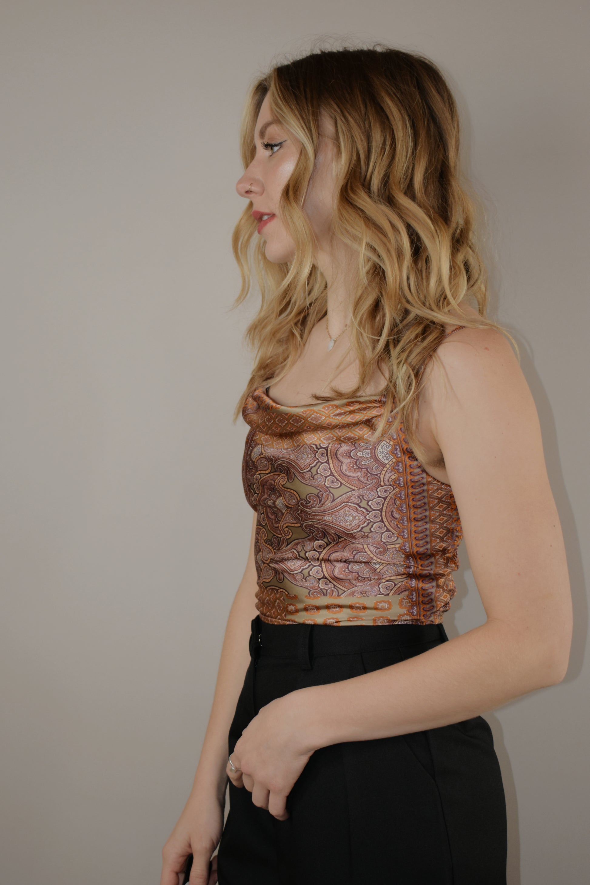 paisley printed satin cropped tank top with adjustable spaghetti straps and a double lined front bodice with a smocked stretchy back and a cowl square neckline