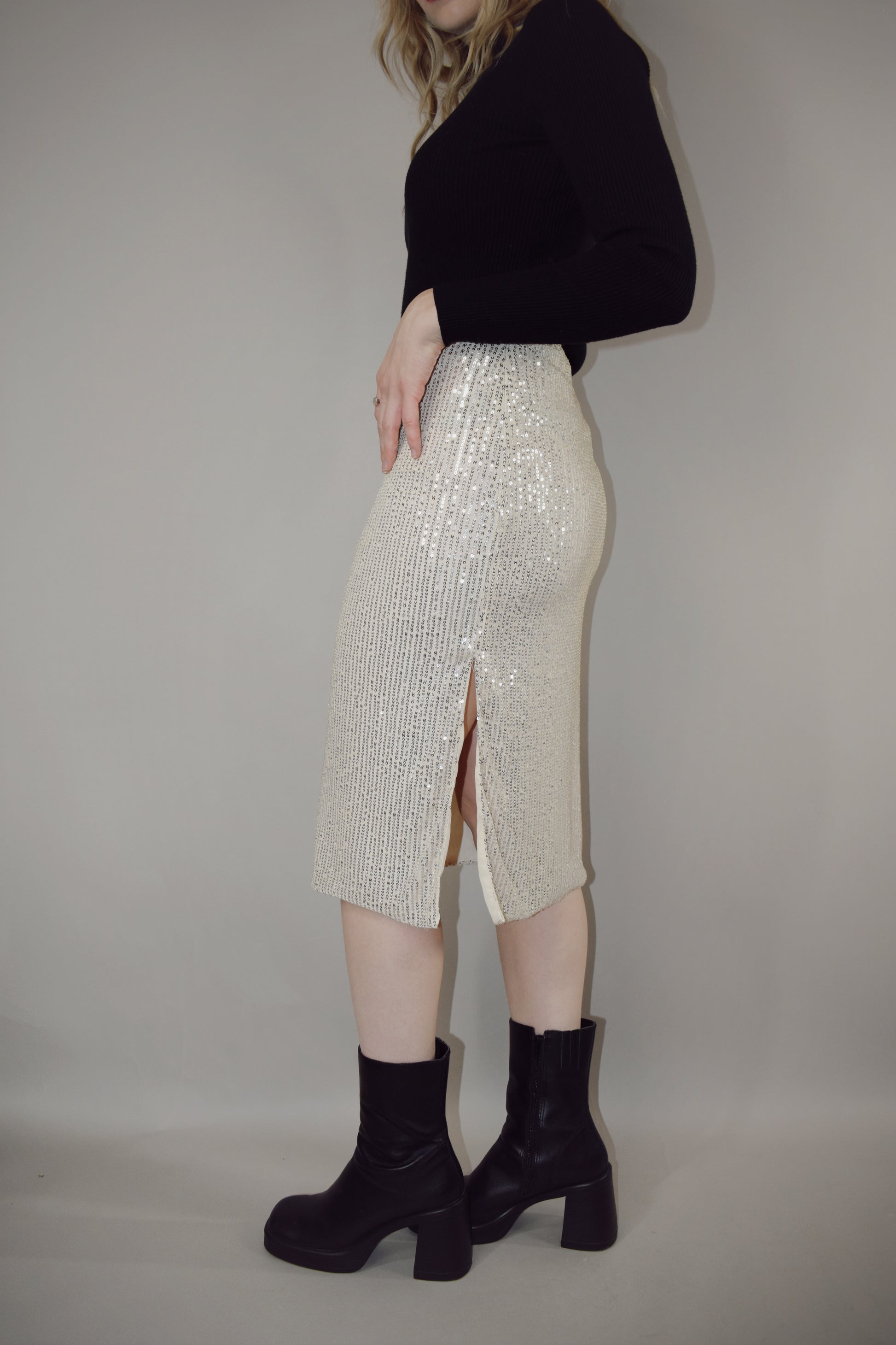 ivory sequin midi pencil skirt with side slit and side zip enclosure hits just below the knee