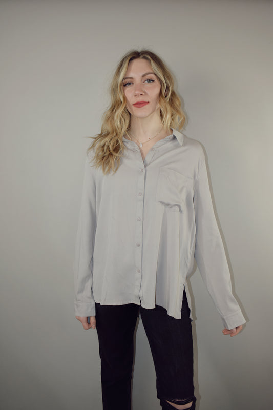 long sleeve full length button down with one patch breast pocket slits along sides on hem 