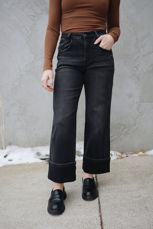 high rise stretch denim black wash no holes wide leg double panel with double front pocket has beltloops zip and button enclosure wide cuff at hem that can be uncuffed