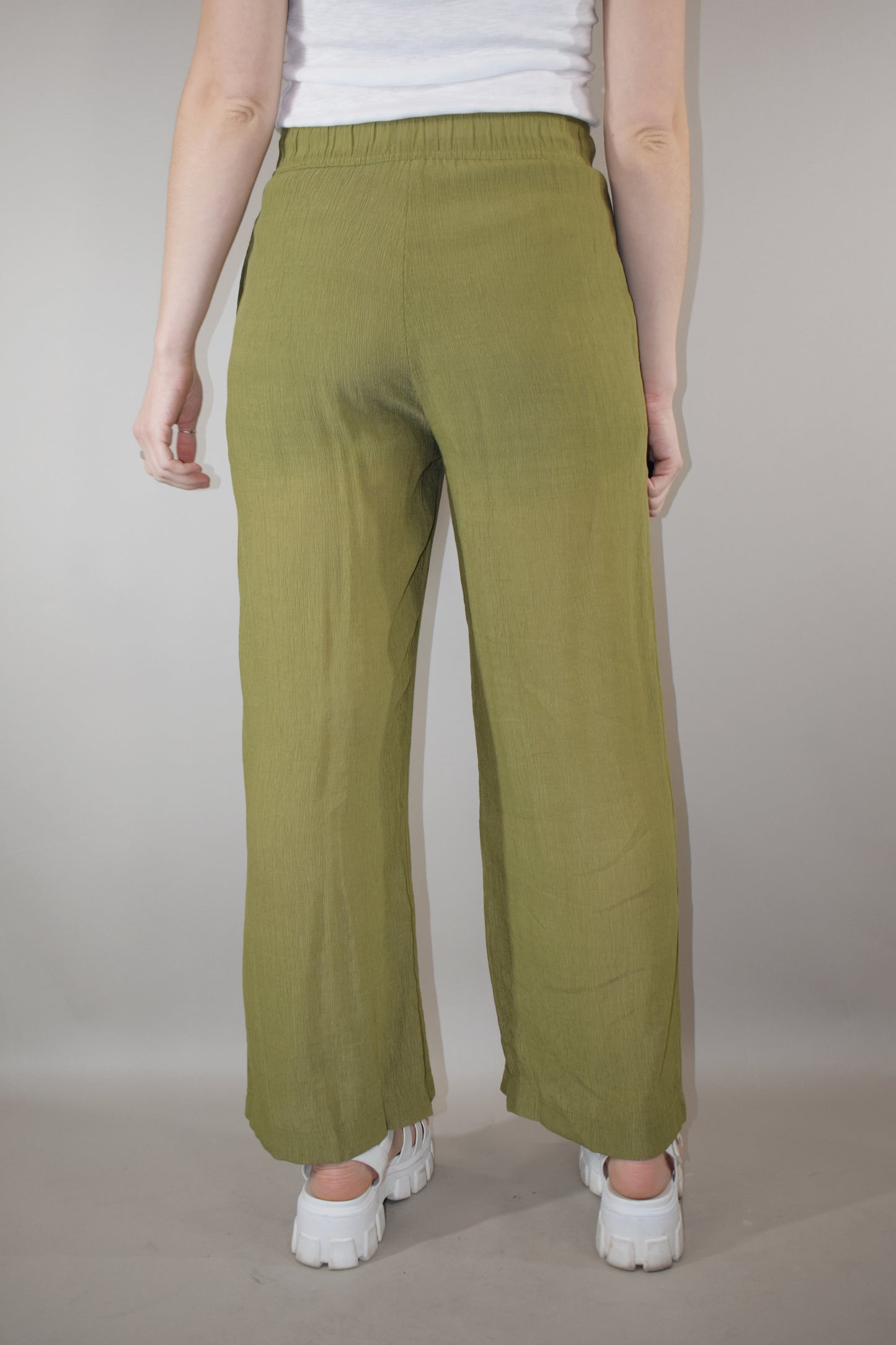 breezy lightweight olive pants slight wide leg high waisted with elastic waistband and shorts length liner has pockets in front not in back