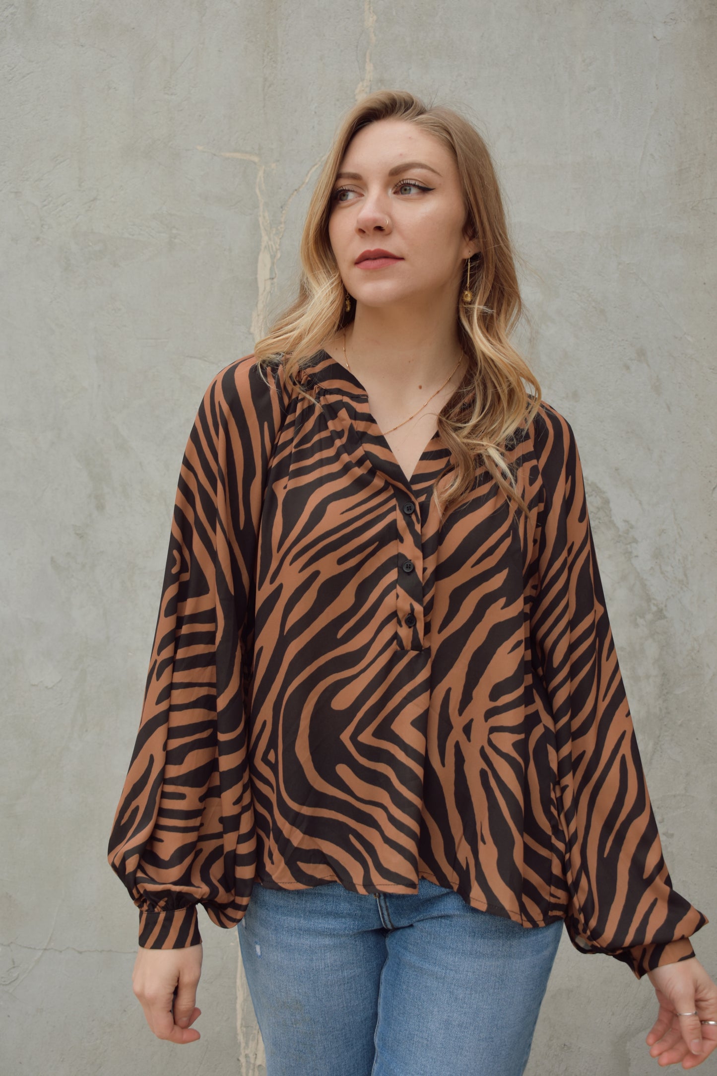 black and brown long sleeve animal print blouse with v neck and hidden buttons on front, full length flowy fit, balloon sleeves