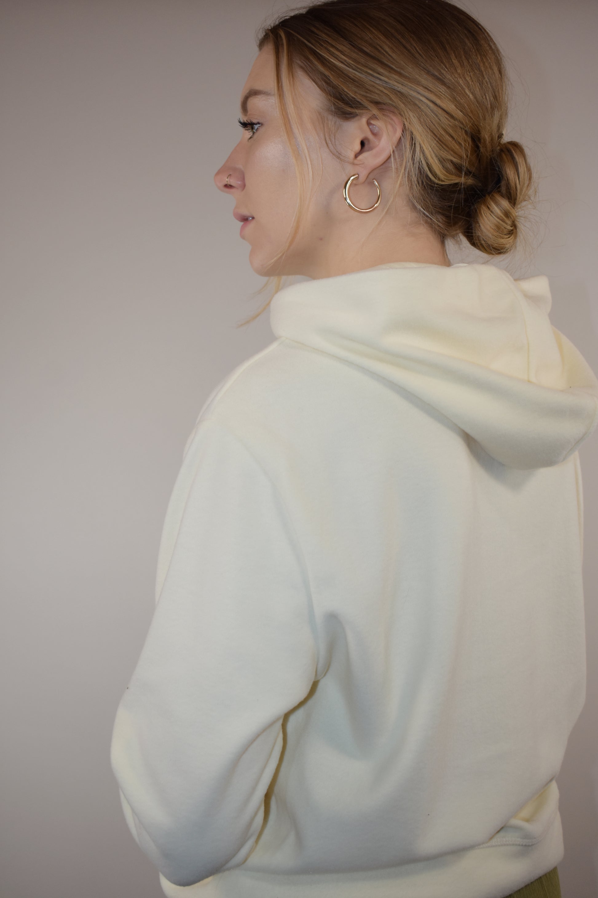 fleece hoodie with slight cowl neck and hood. has pockets that aren't connected. loose fitting full length