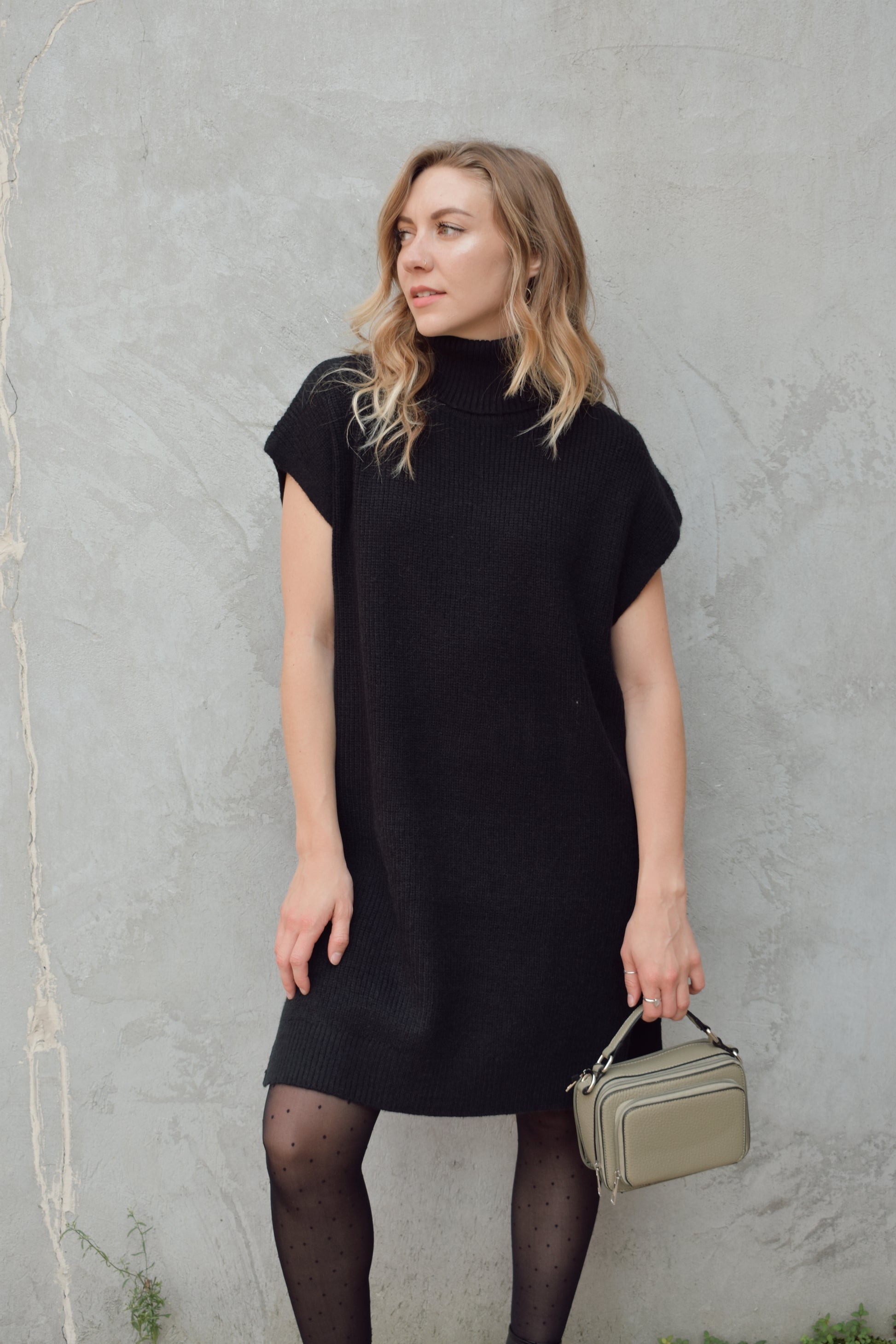 turtleneck sleeveless mini sweater dress hits rig above the knee has slits on side of hem relaxed cap sleeve, straight fit