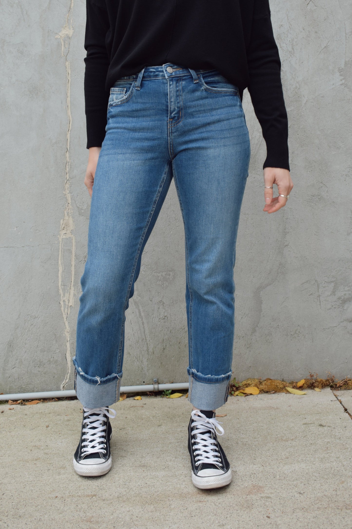 straight fit cuffed stretch denim distressing on cuffs high rise medium wash