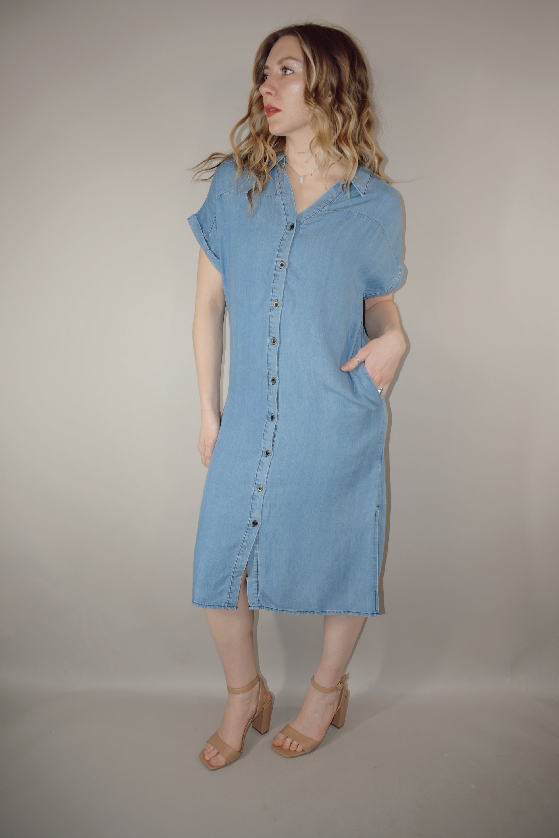 Tencel medium wash denim button down collared t shirt midi dress with side slits, side pockets, cuffed short sleeves