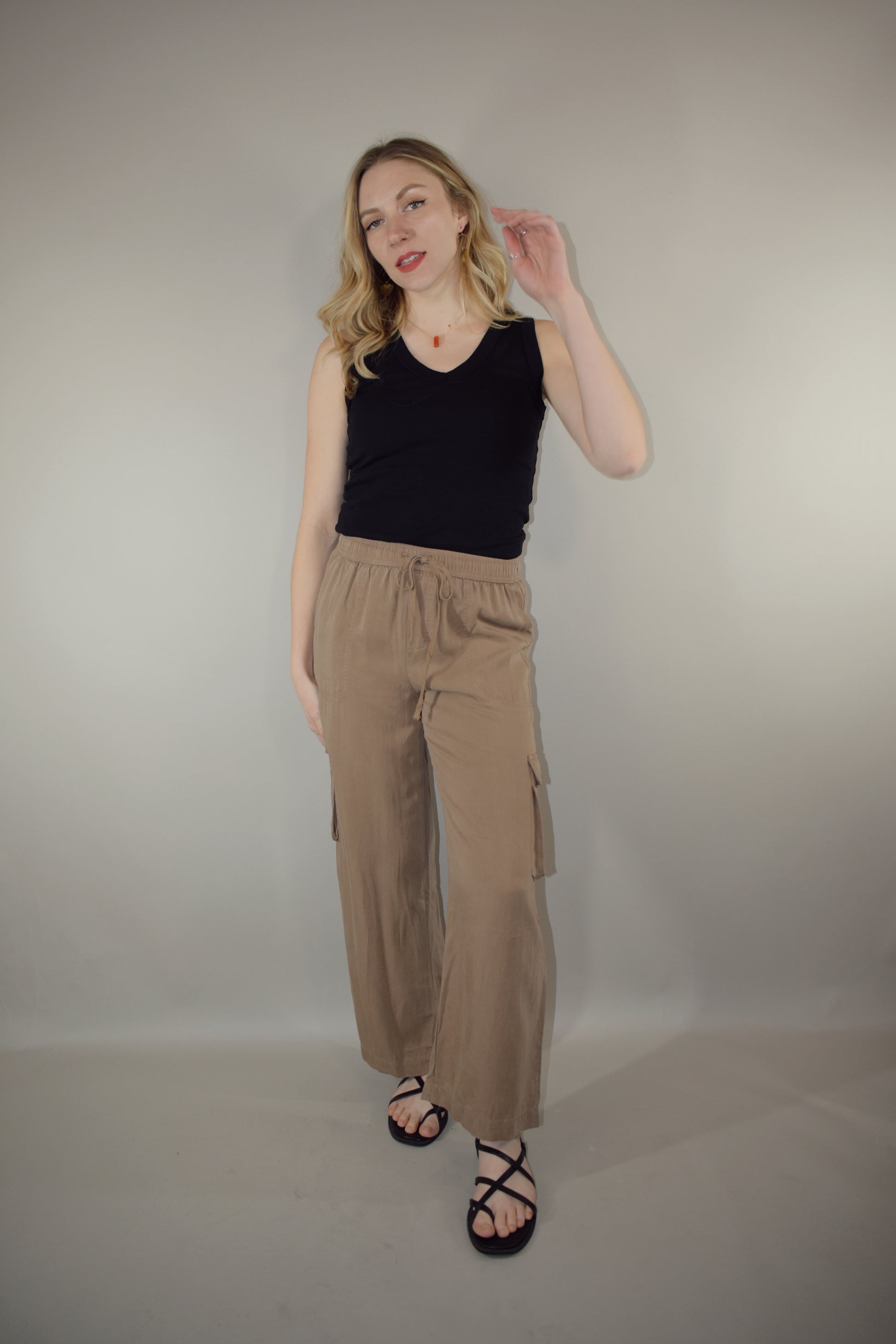 tencel cargo pants with slight wide leg elastic waistband with drawstring side pockets and side cargo pockets patch back pockets