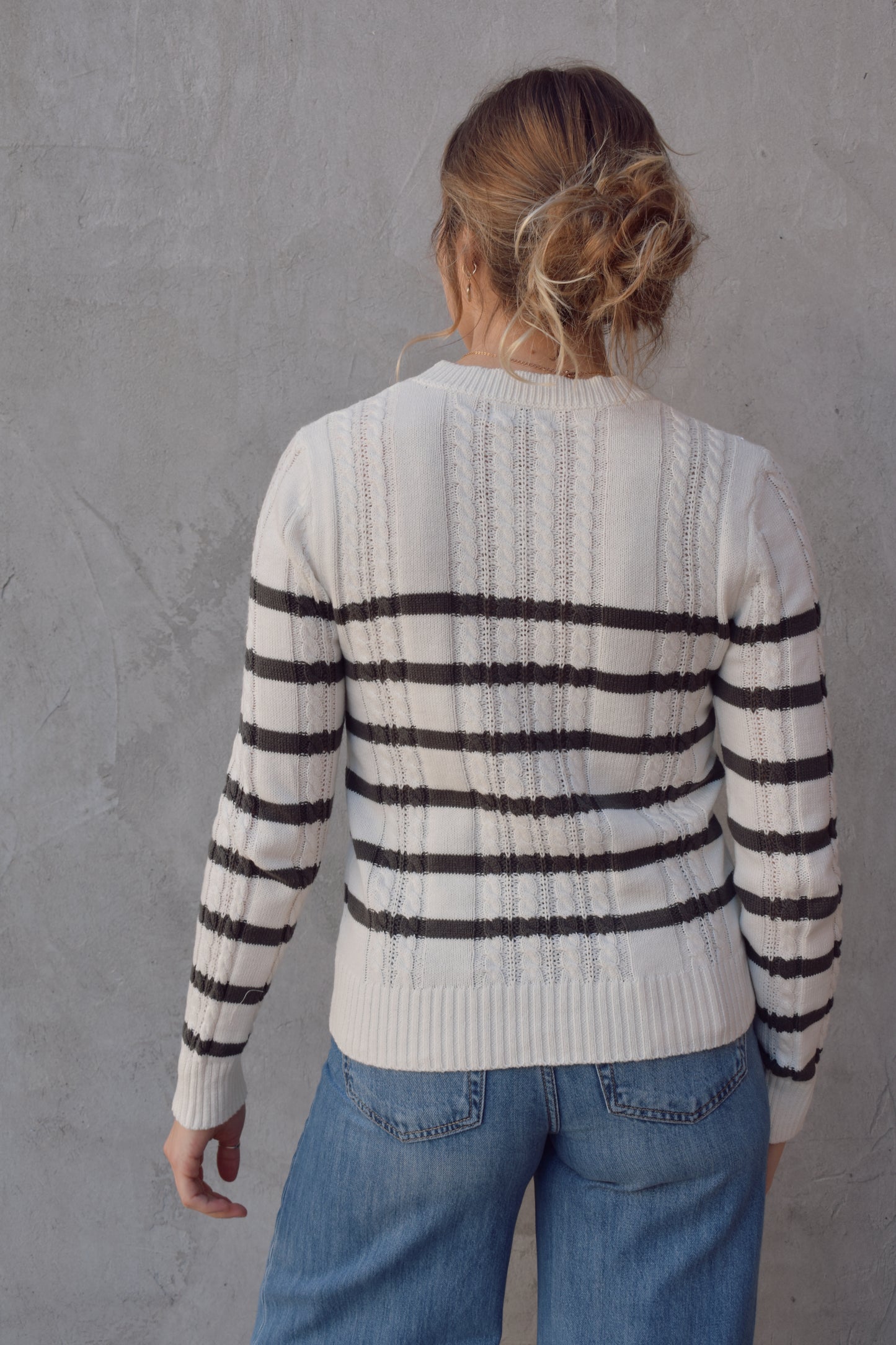 ivory crew neck long sleeve lightweight cable sweater with grey horizontal stripes across bodice and sleeves. cable texture is vertical. full length, ribbed cuffs, hem and neckline. 