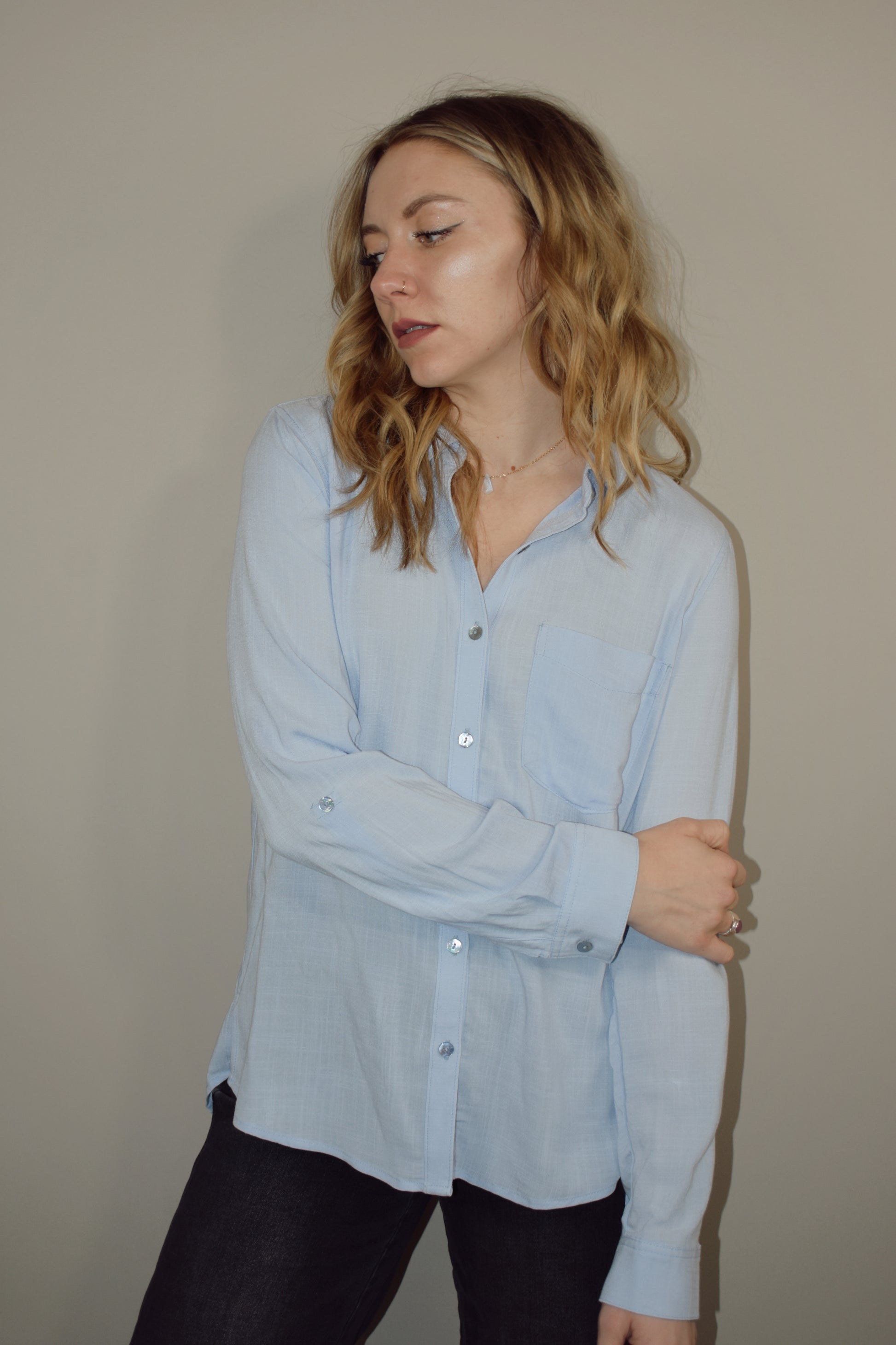 relaxed fit full length light weight button down with button fastener if you want to cuff them and one breast patch pocket. slits on side by hem. beachy