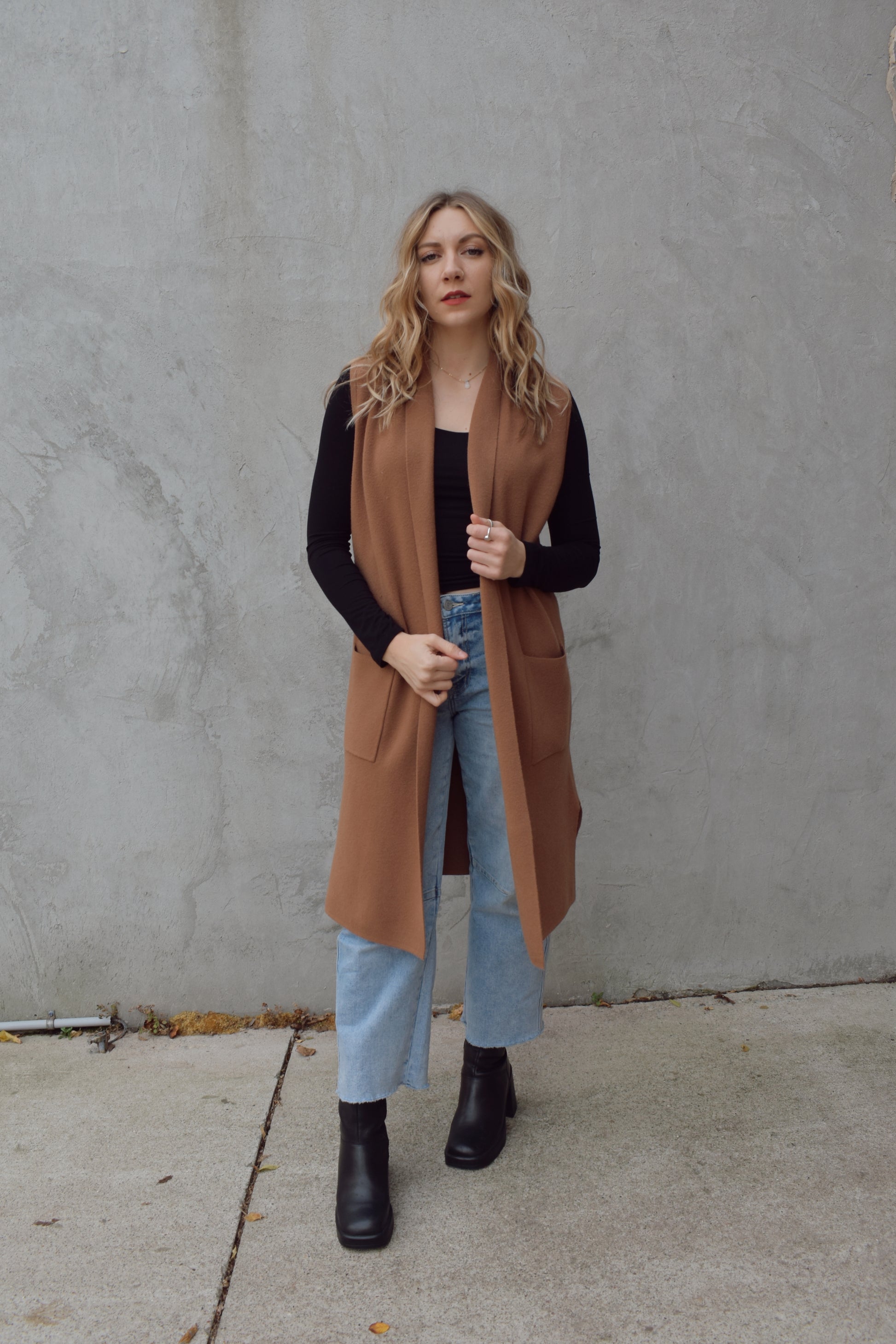 longline cardigan vest with shall collar and front patch pockets. side slits