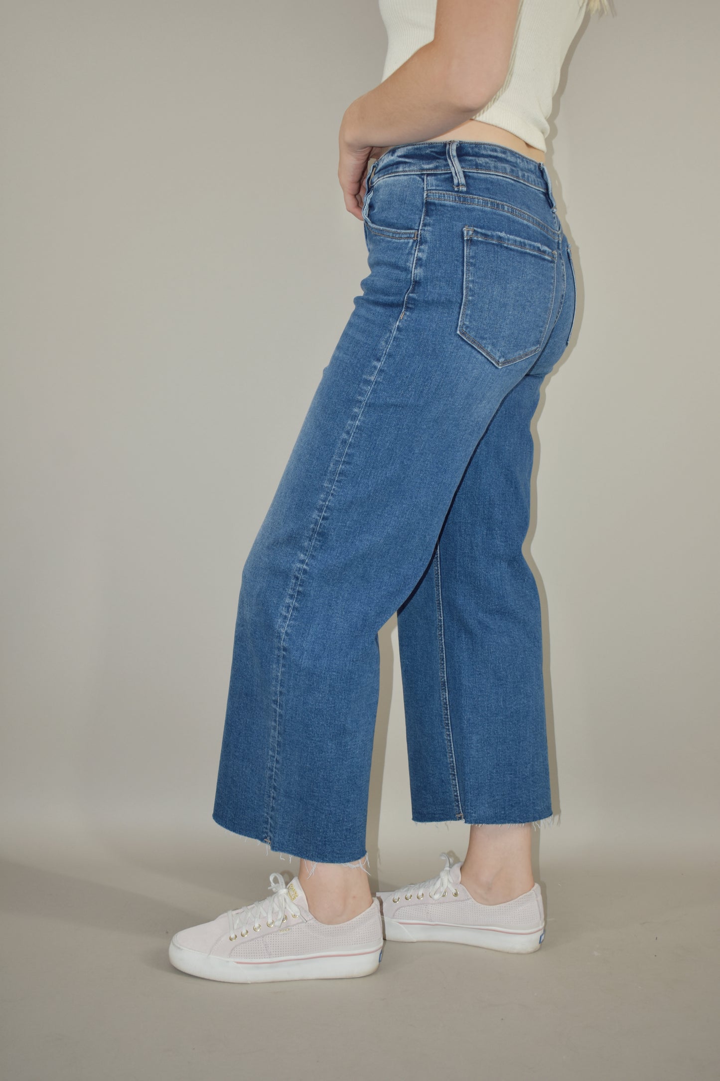 high rise wide leg cropped medium wash stretch denim jeans no holes raw hem