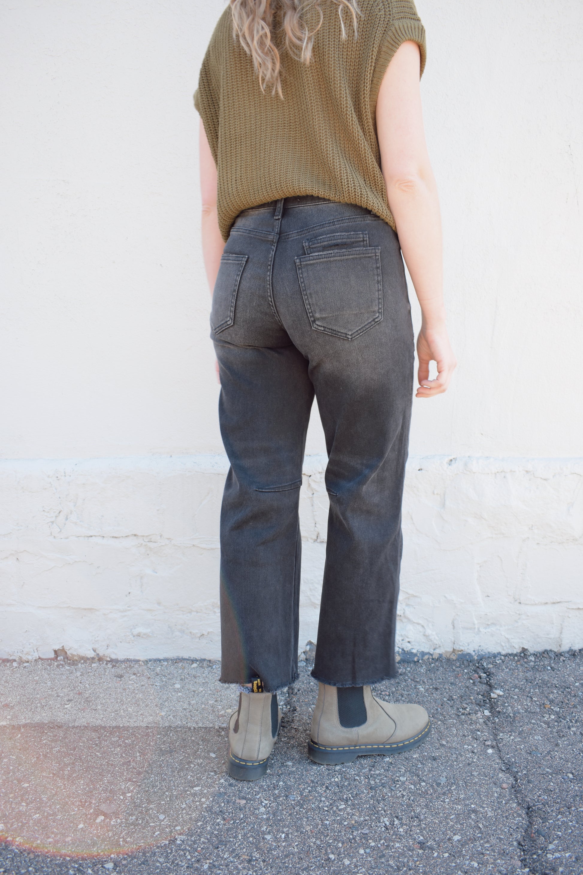 black washed cropped slight barrel jeans stretch denim slanted patch pockets, raw hem, seam detail at knee, high rise, no holes