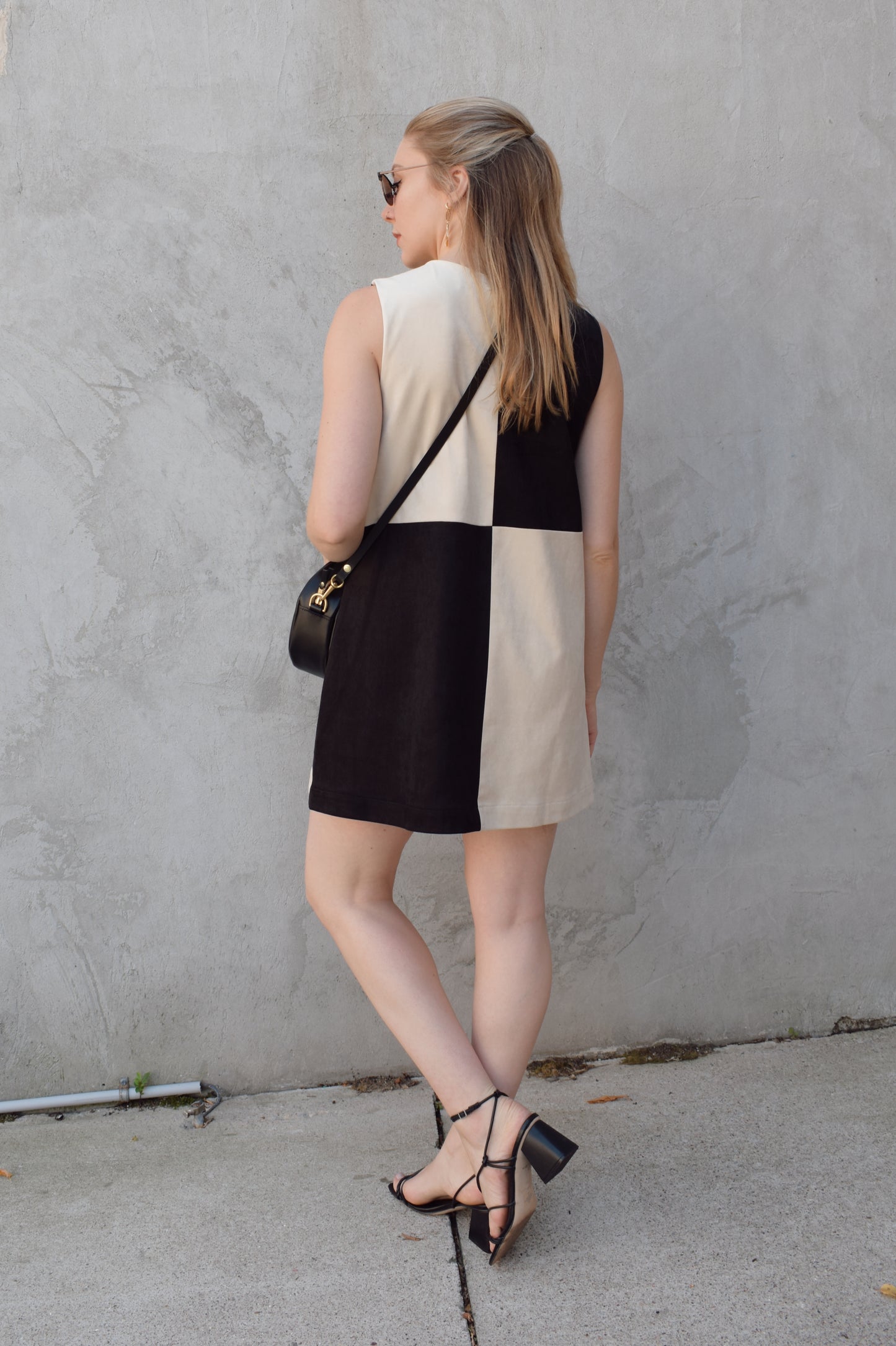 black and ivory color block shift mini dress high neckline sleeveless has pockets