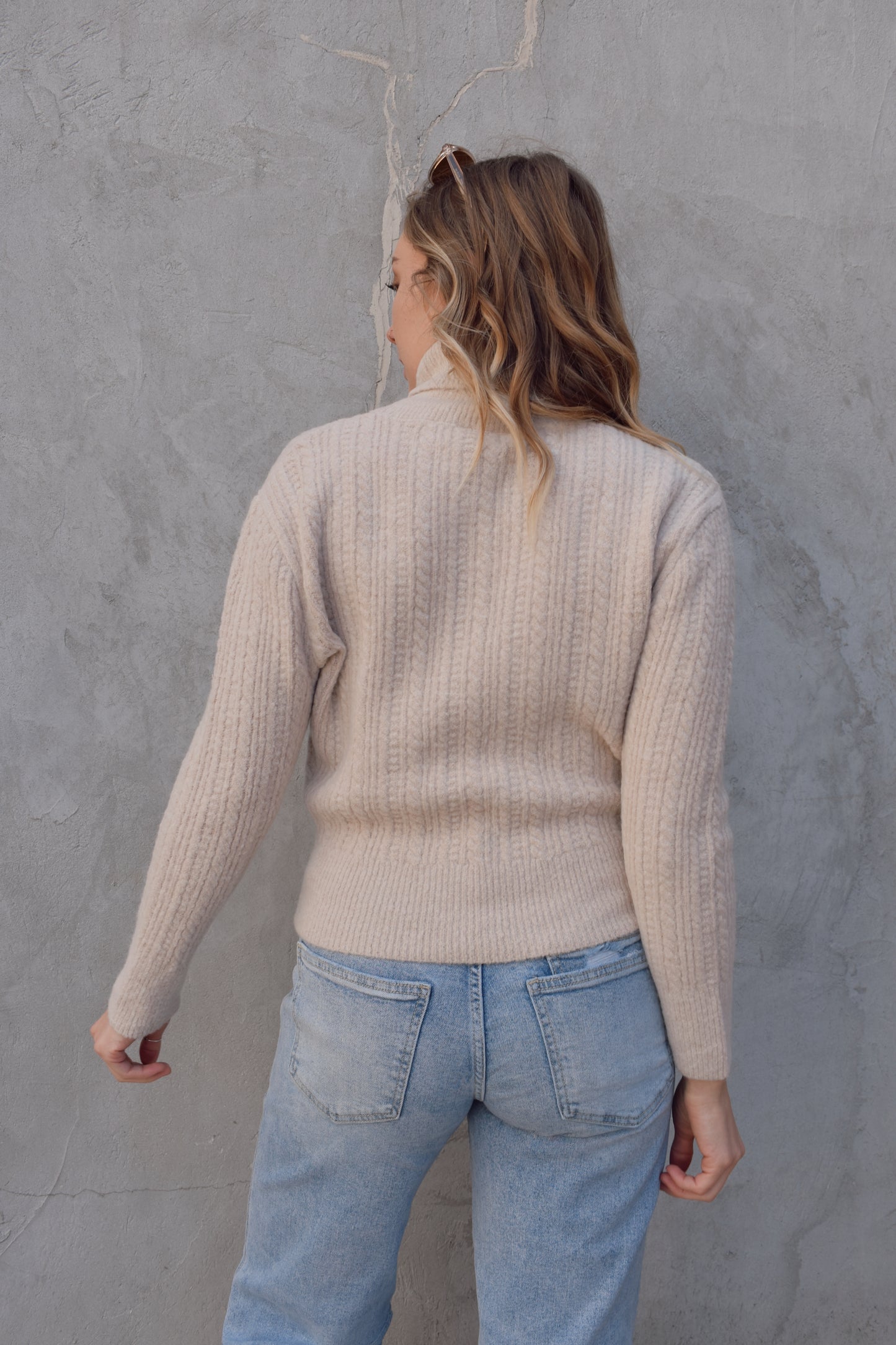 cable knit turtleneck sweater full length relaxed fit neck folds over drop shoulders
