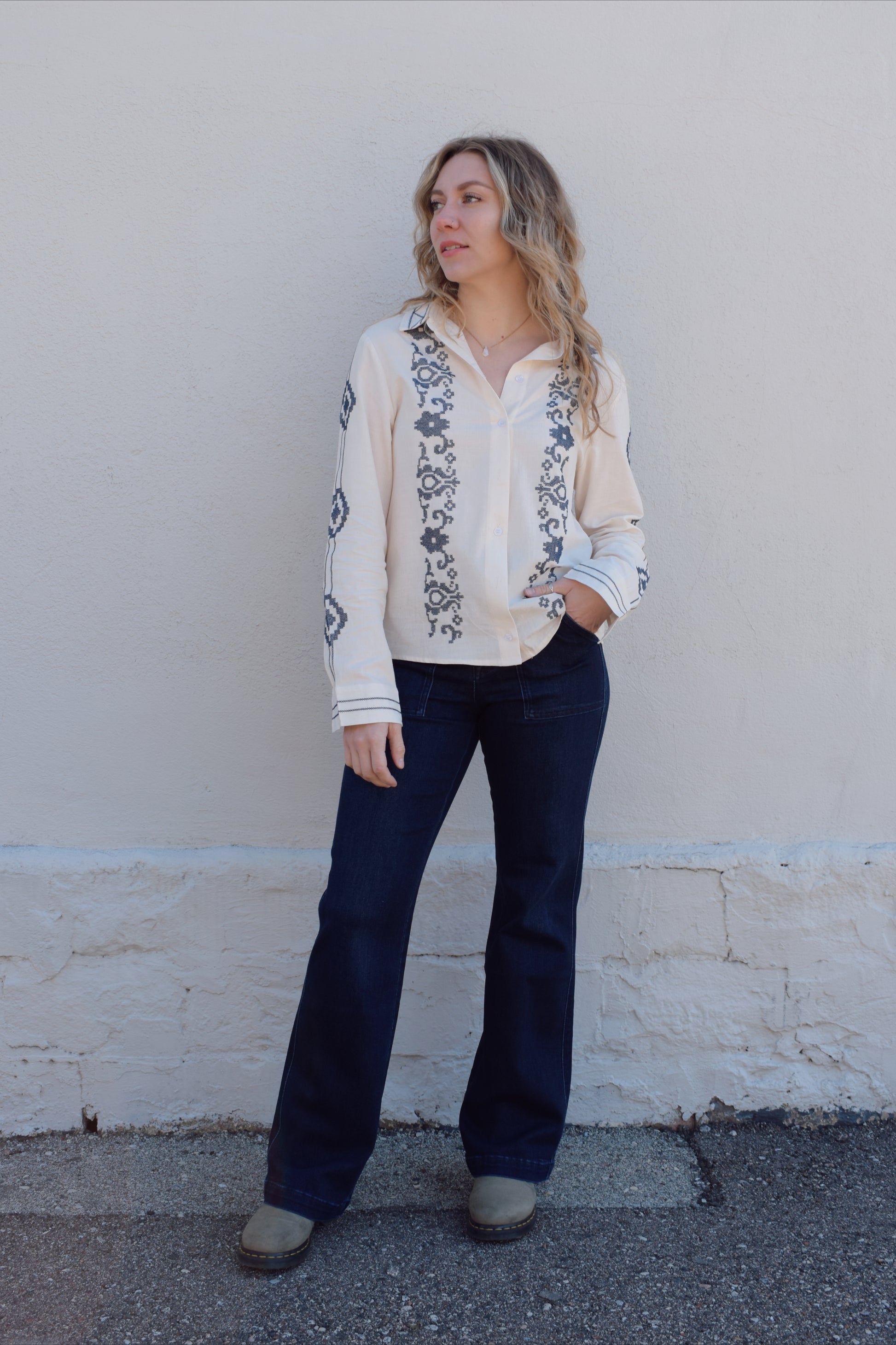 ivory button down full length with denim blue embroidery details along front, down sleeves, collar and cuffs. button cuffs, straight relaxed fit