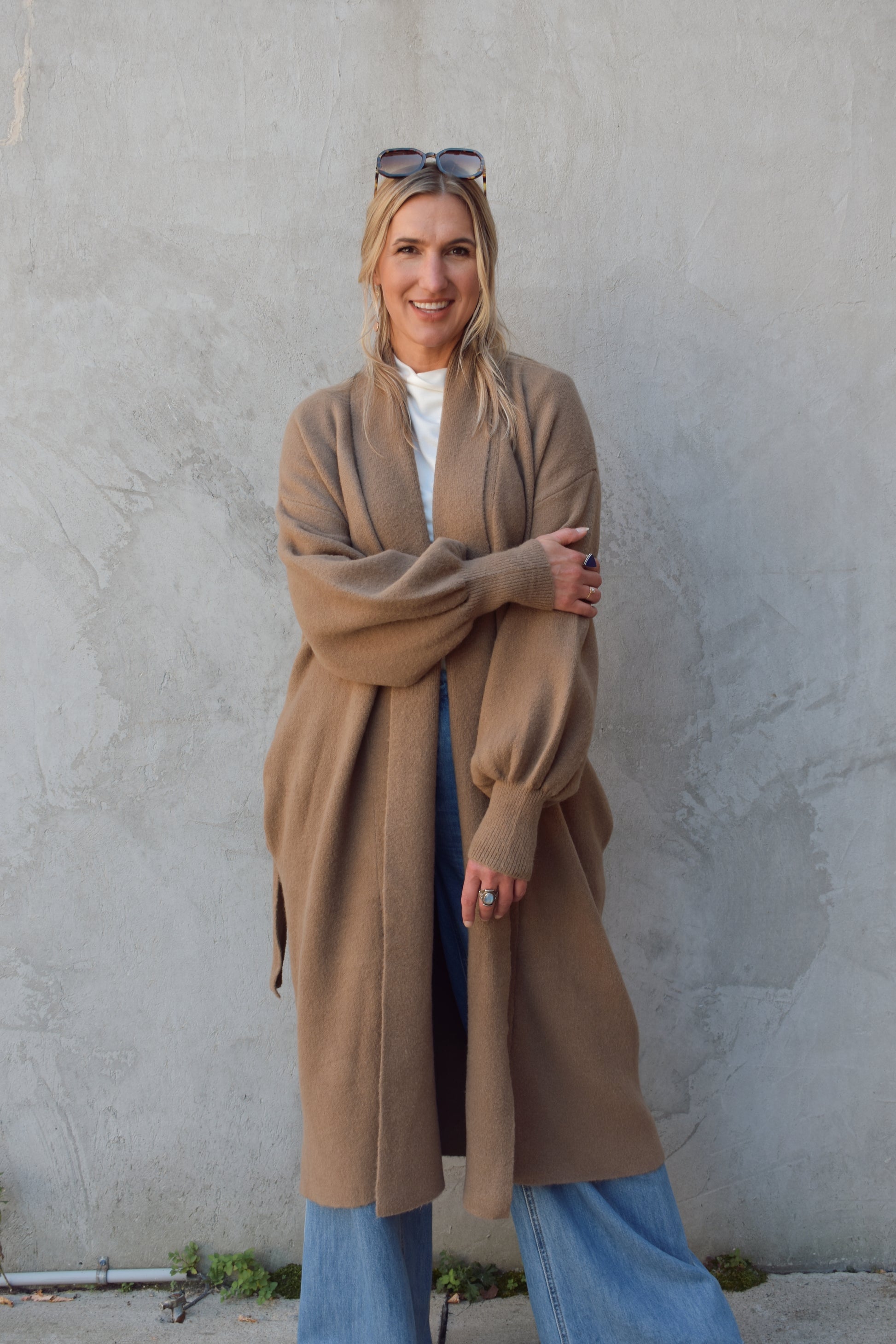 heavyweight cozy belted cardigan with fitted cuffs and pockets folds at collar hits at mid calf