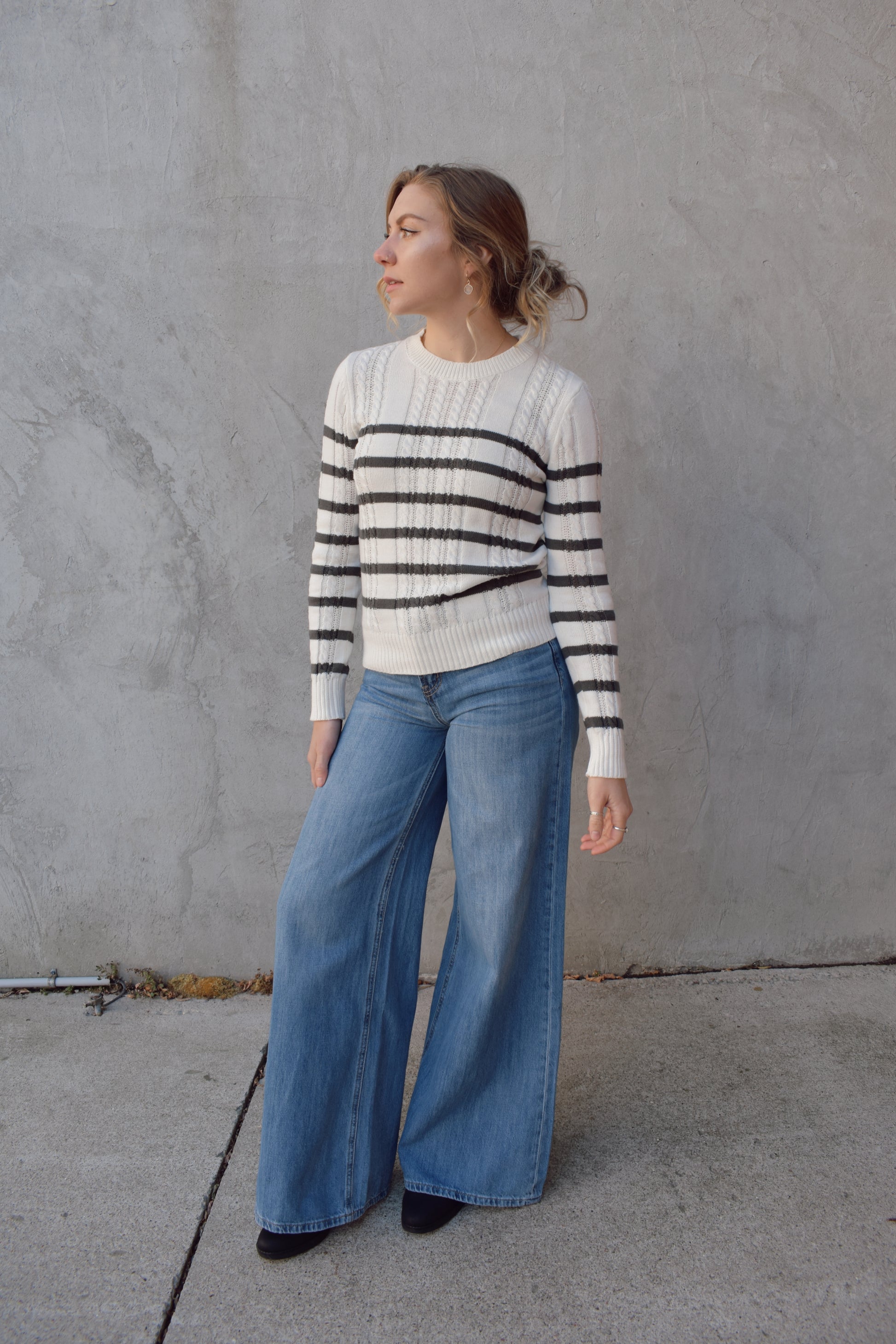 ivory crew neck long sleeve lightweight cable sweater with grey horizontal stripes across bodice and sleeves. cable texture is vertical. full length, ribbed cuffs, hem and neckline. 