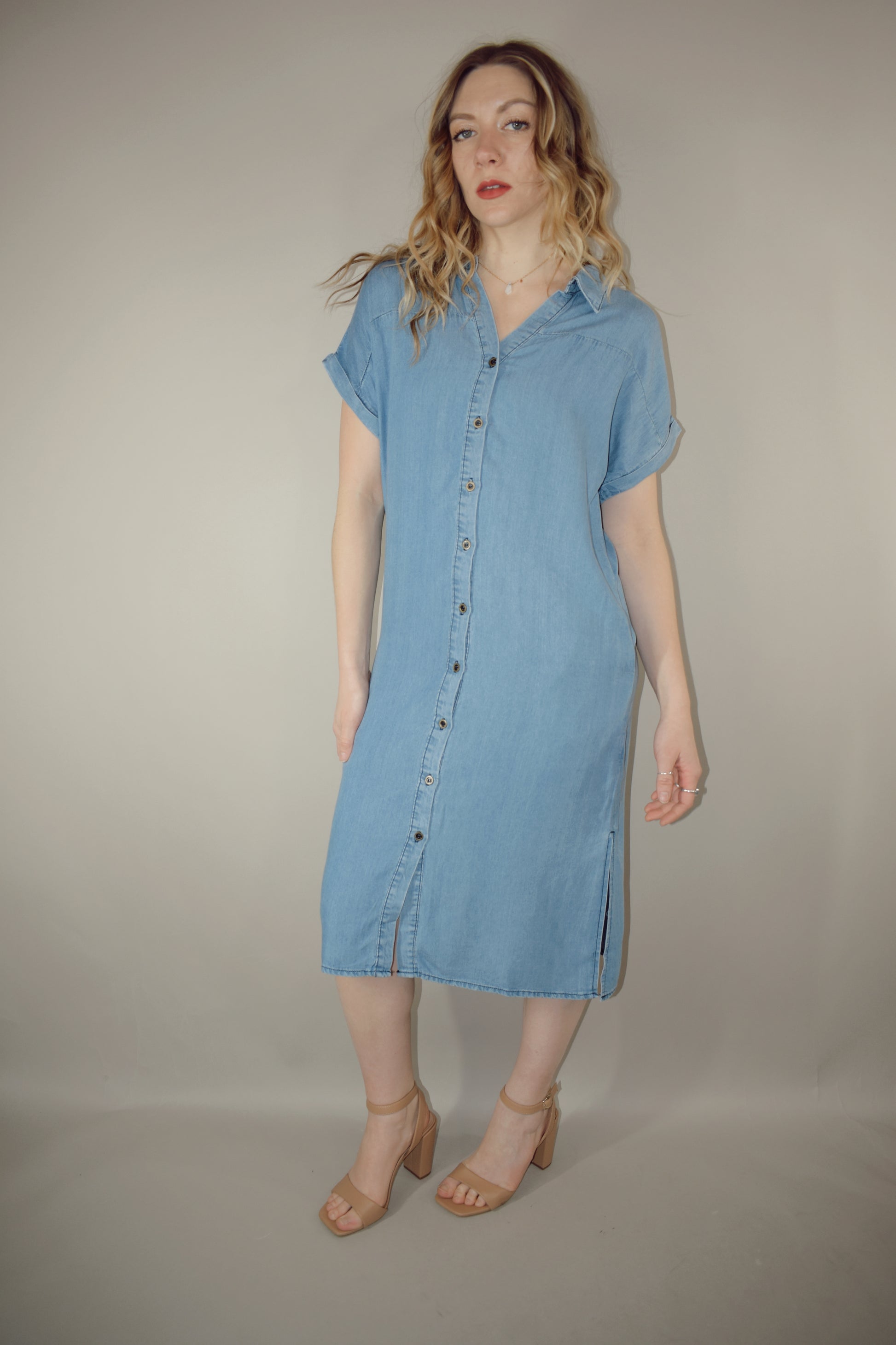 Tencel medium wash denim button down collared t shirt midi dress with side slits, side pockets, cuffed short sleeves