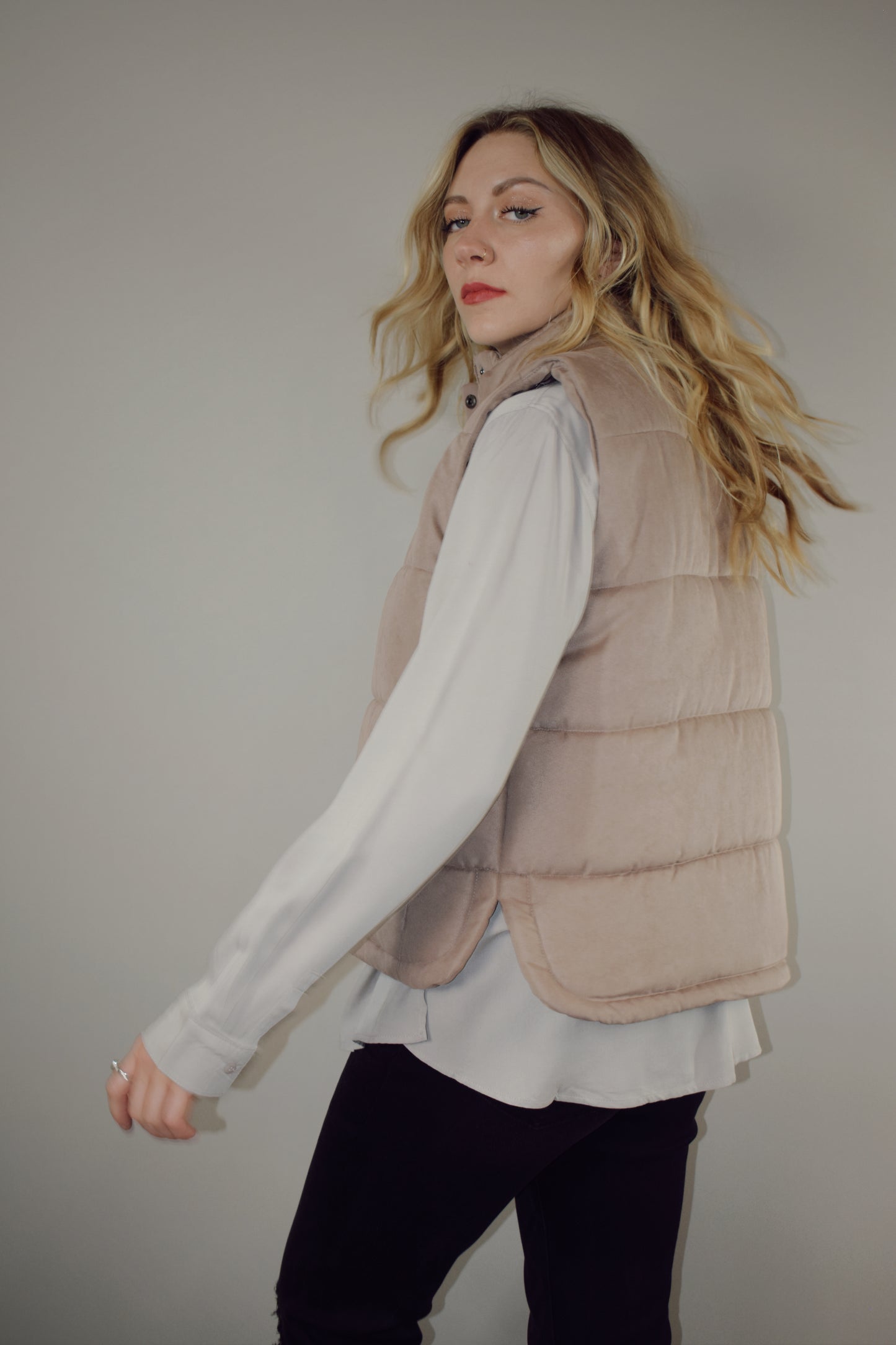 super soft suede like fabric full length puffer vest with collar zip and snap front enclosure has pockets 