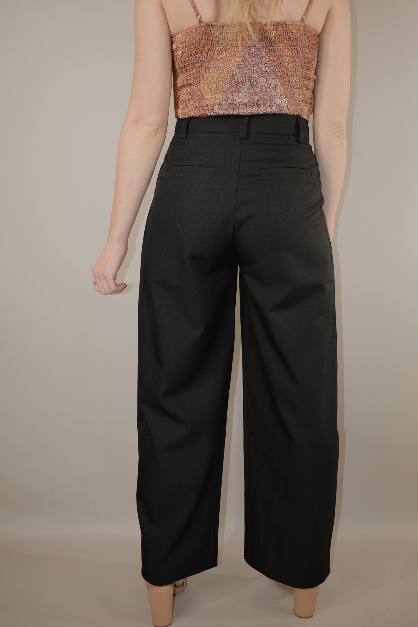 high waisted black pin tuck pleat trousers full length has beltloops, side pockets, fake back pockets, button clasp and zip enclosure