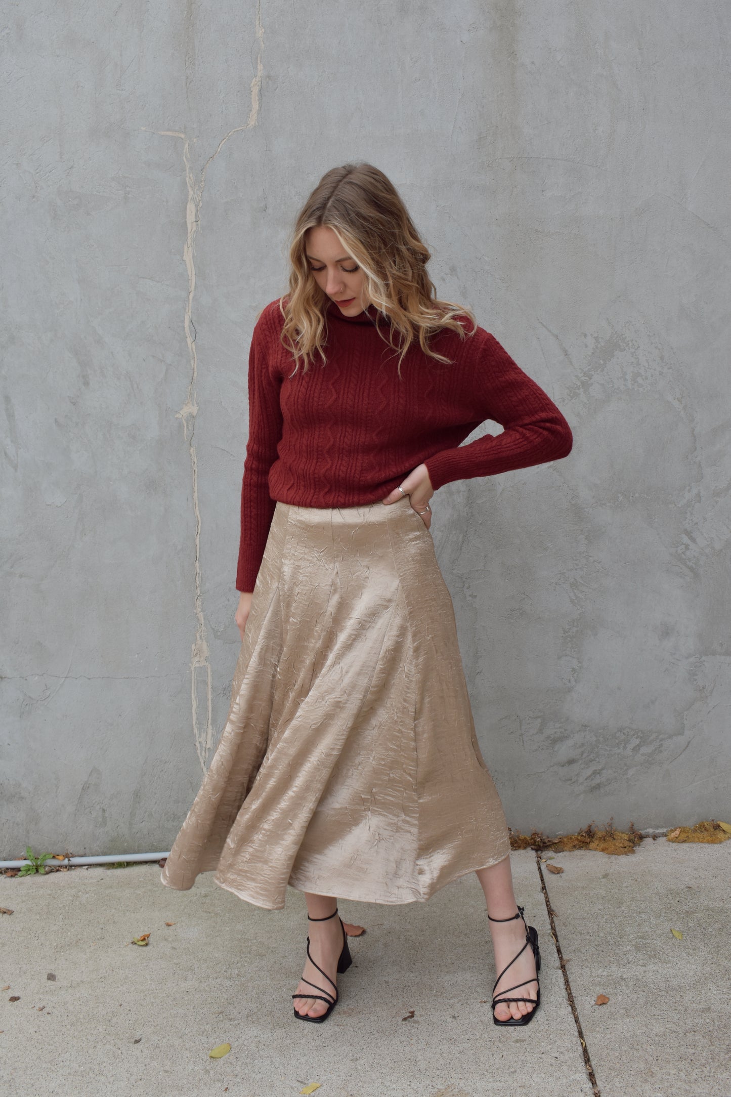 textured gold midi skirt with pleated details, a line flare, zip back enclosure, fitted waist