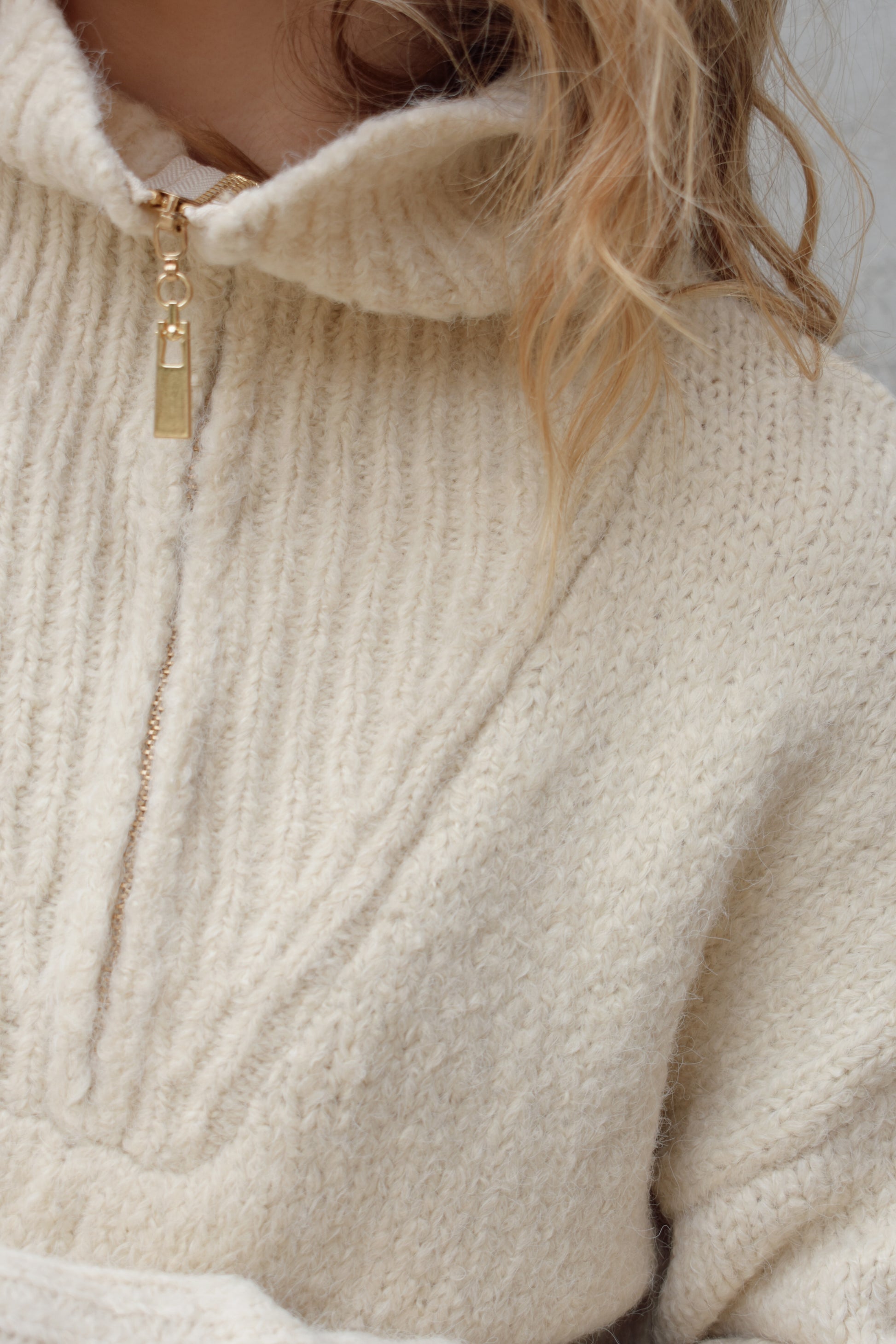 cozy knit blend quarter zip sweater with fold over collar, ribbed hem, full length and loose fit, drop shoulders