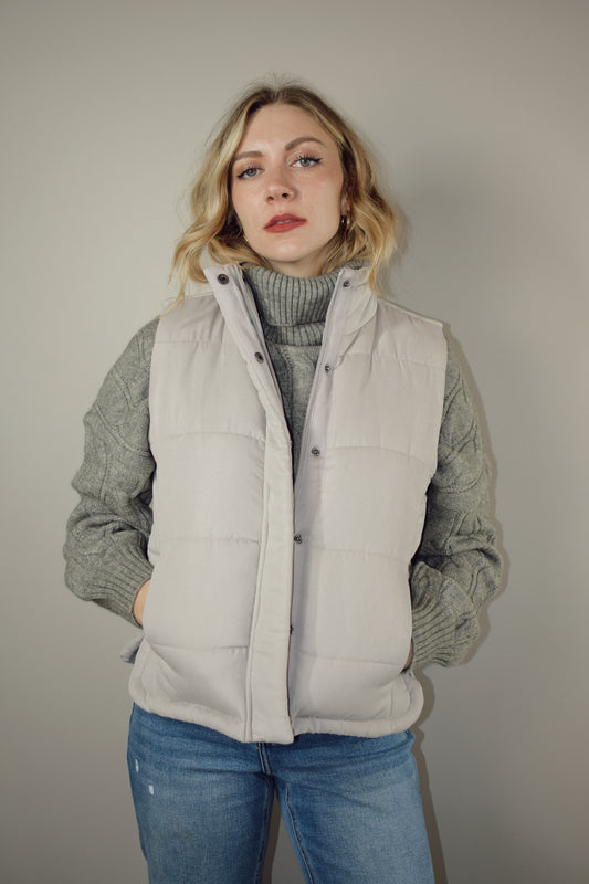 super soft suede like fabric full length puffer vest with collar zip and snap front enclosure has pockets 