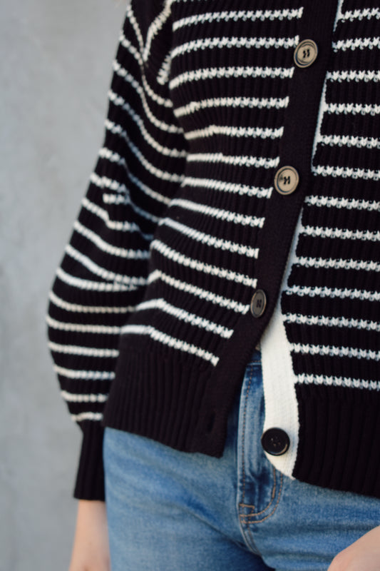 black and white button down cardigan with horizontal stripes drop shoulder balloon sleeves straight fit full length solid white neckline solid black cuffs and hem