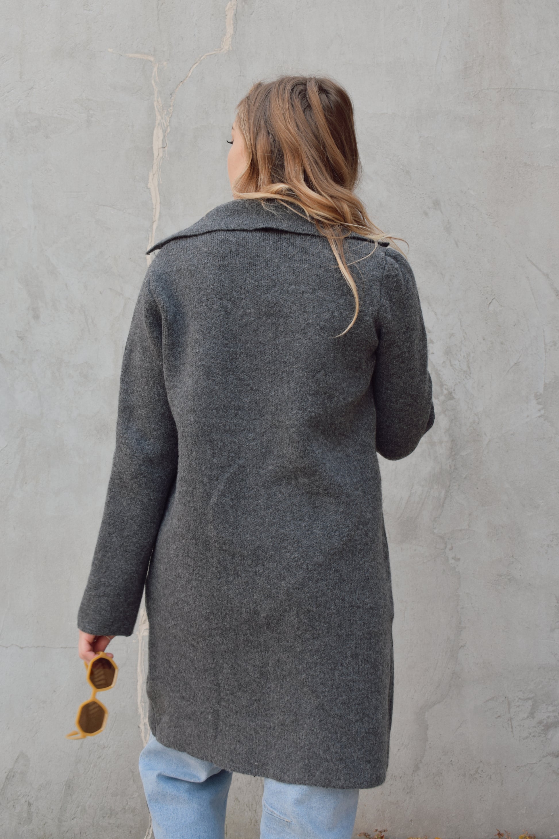 pea coat style cardigan with notched collar two button enclosure front patch pockets, hits above the knee.