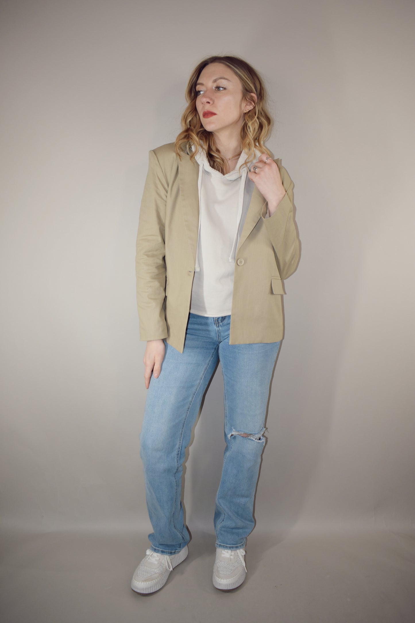 nude linen blazer full length front pockets with flap enclosure single button enclosure slit in back hemline relaxed shoulder pad structure