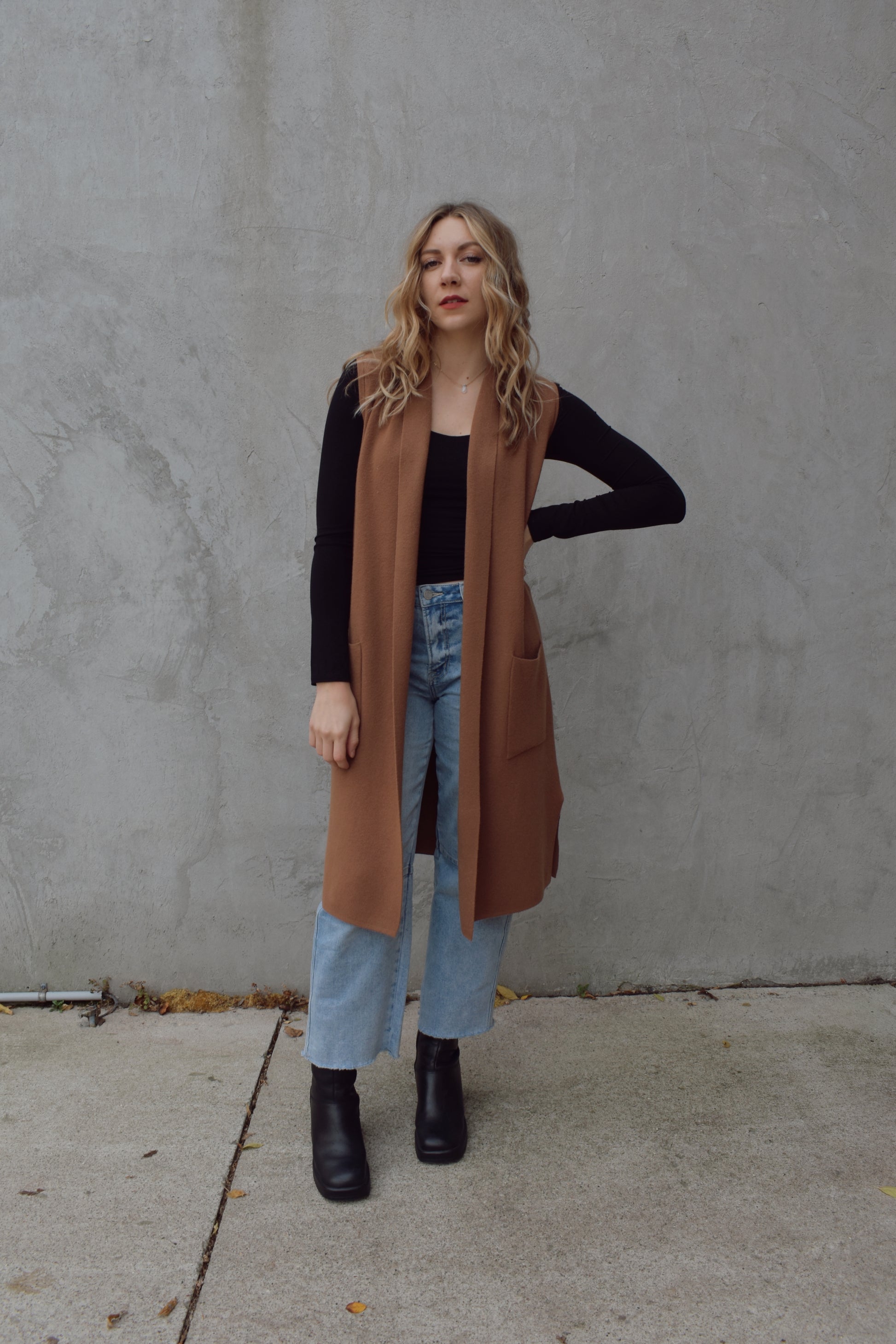 longline cardigan vest with shall collar and front patch pockets. side slits