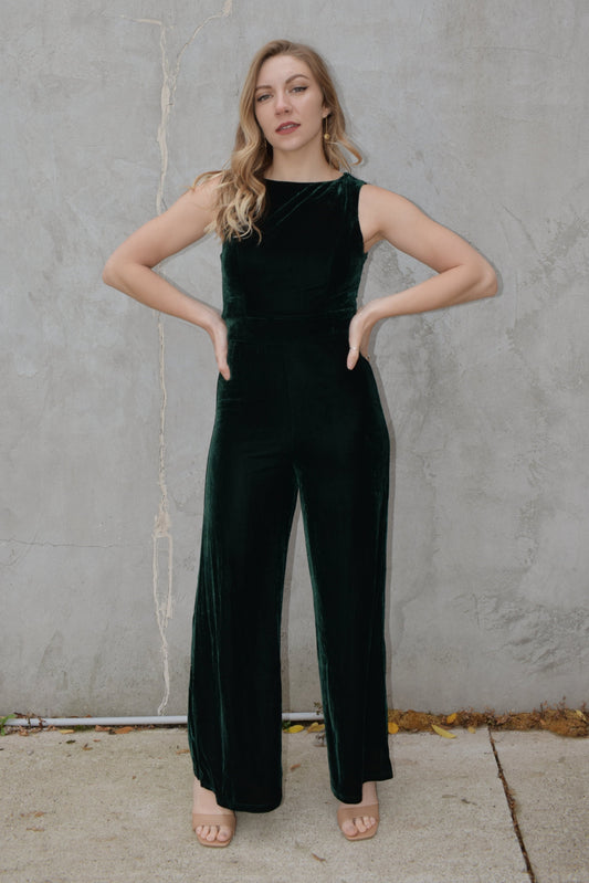 sleeveless crew neck dark green velvet jumpsuit with zip back enclosure, fitted waist and bodice, full length wide legs