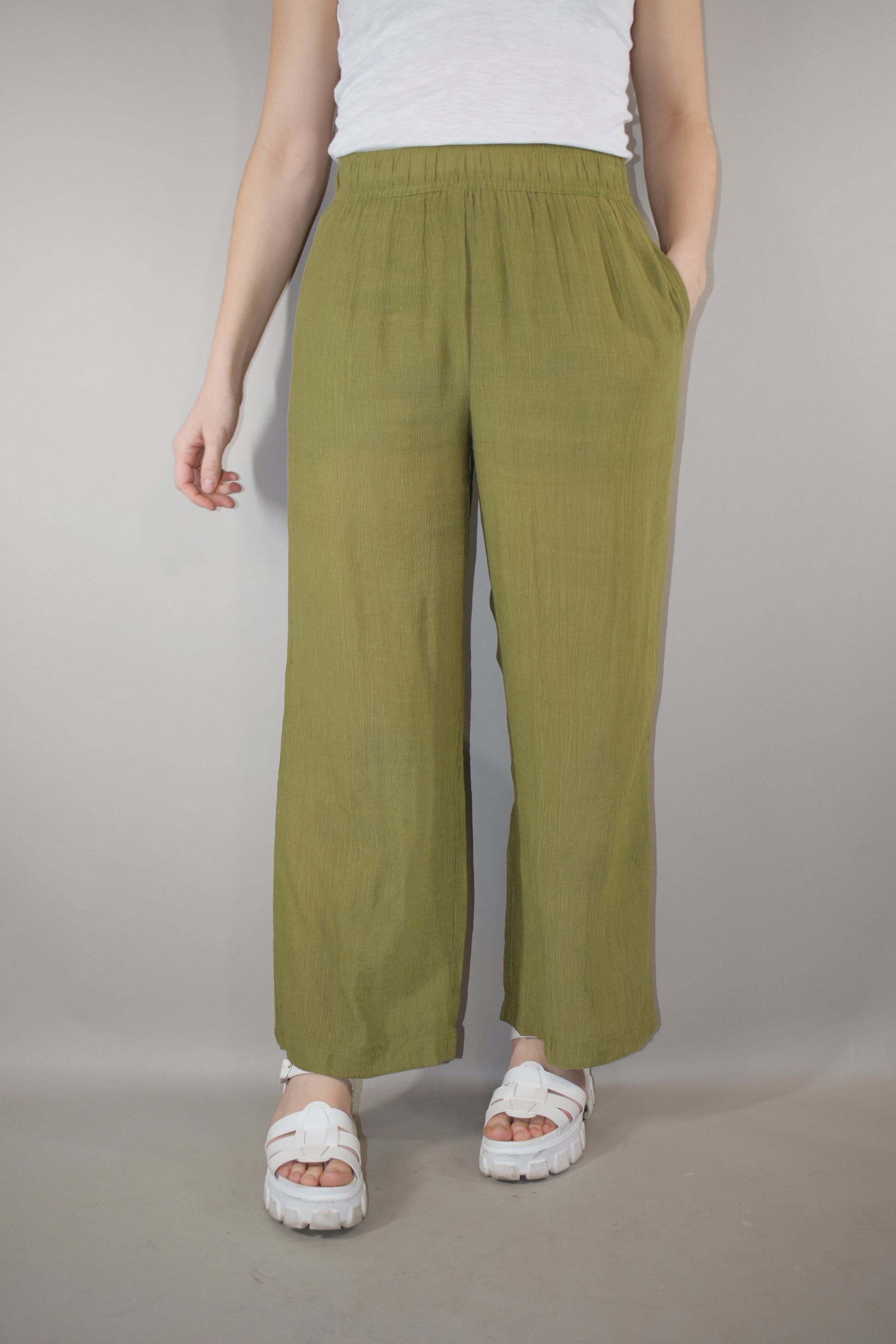 breezy lightweight olive pants slight wide leg high waisted with elastic waistband and shorts length liner has pockets in front not in back