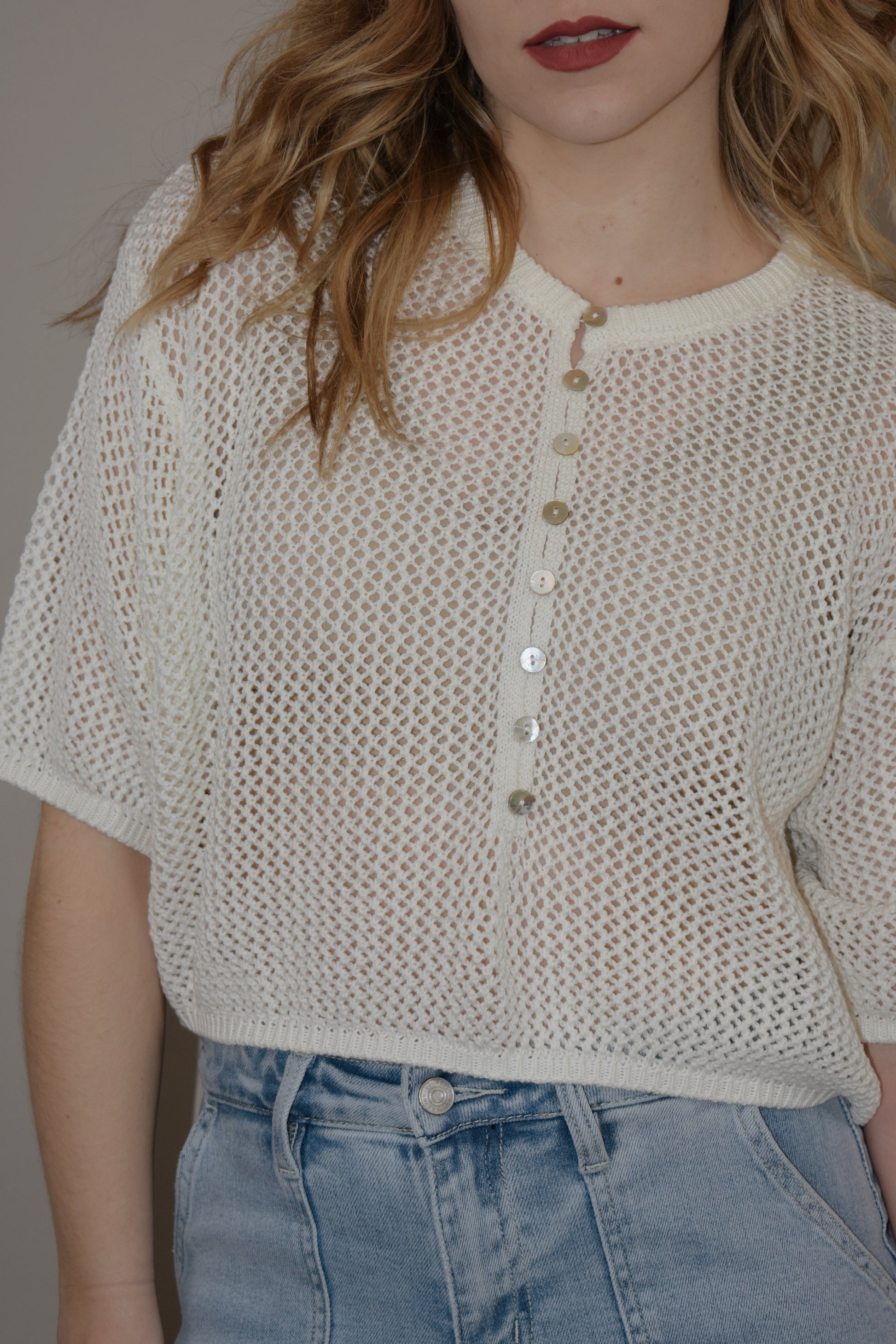 breezy cropped drop shoulder longer short sleeve crocheted shirt with buttons down the front and a crew neck style loose fitting perfect for warm weather