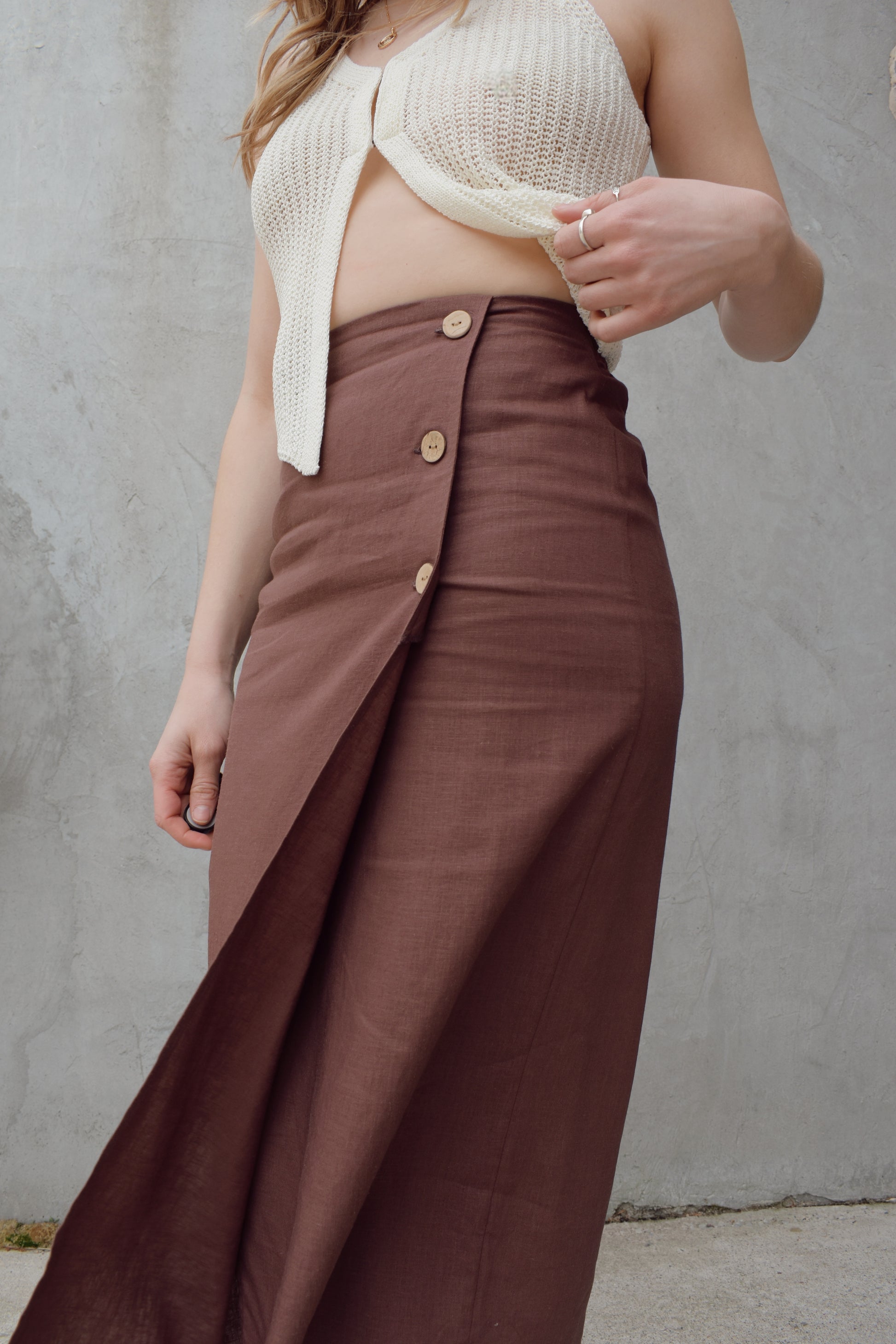 high waisted linen wrap skirt with 3 wooden button enclosure midi length stretch on back of waistband