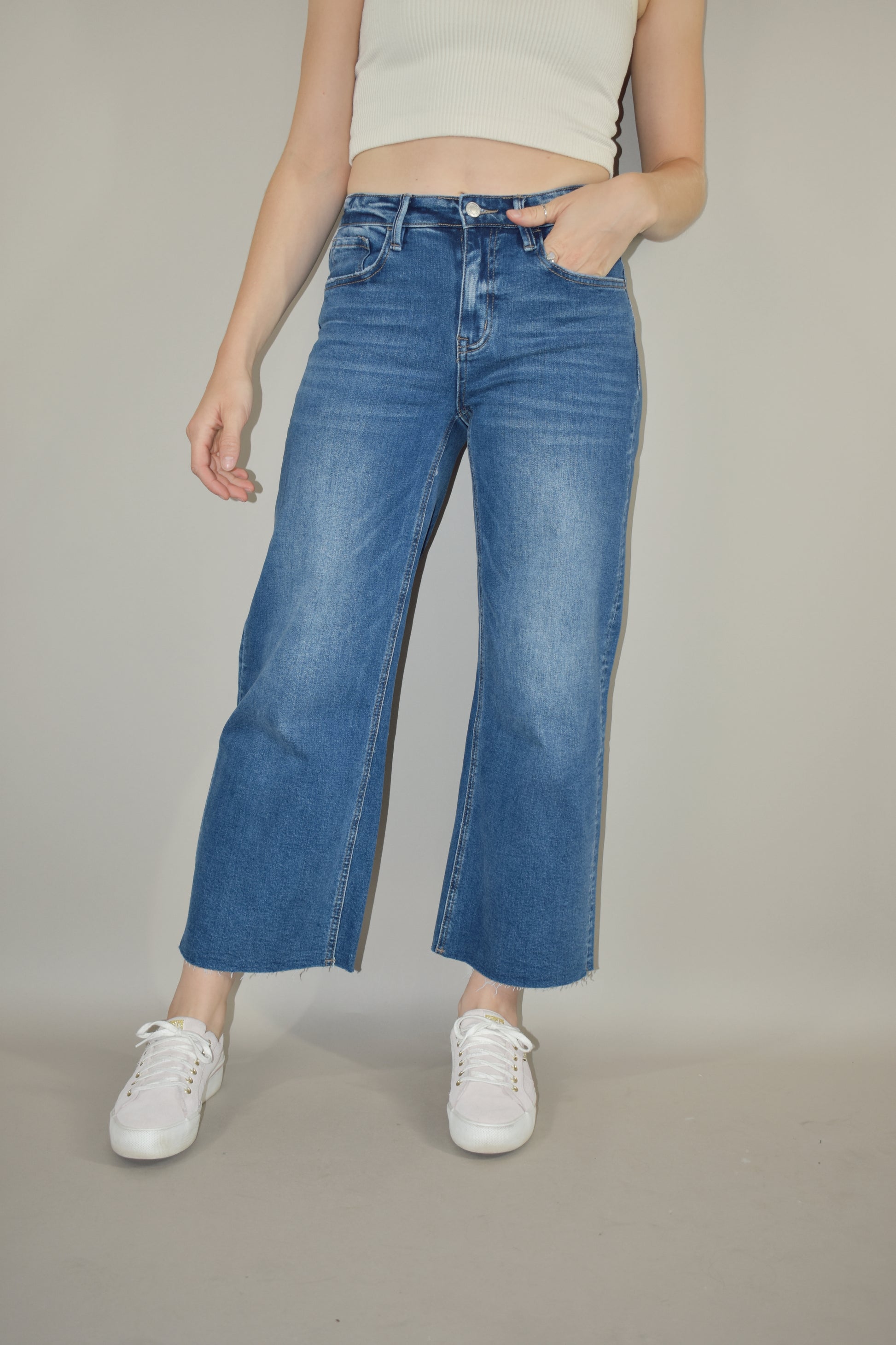 high rise wide leg cropped medium wash stretch denim jeans no holes raw hem