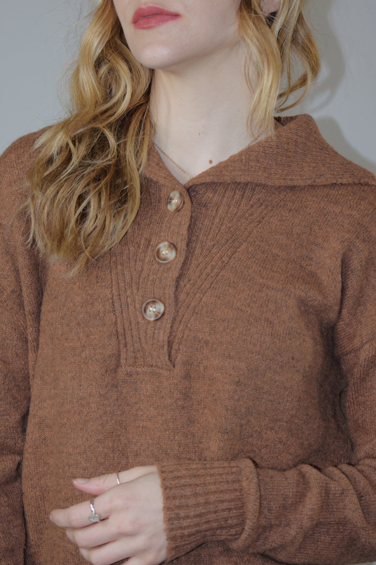 full length sweater with collar and 3 buttons down the neckline with ribbed panel -relaxed fit