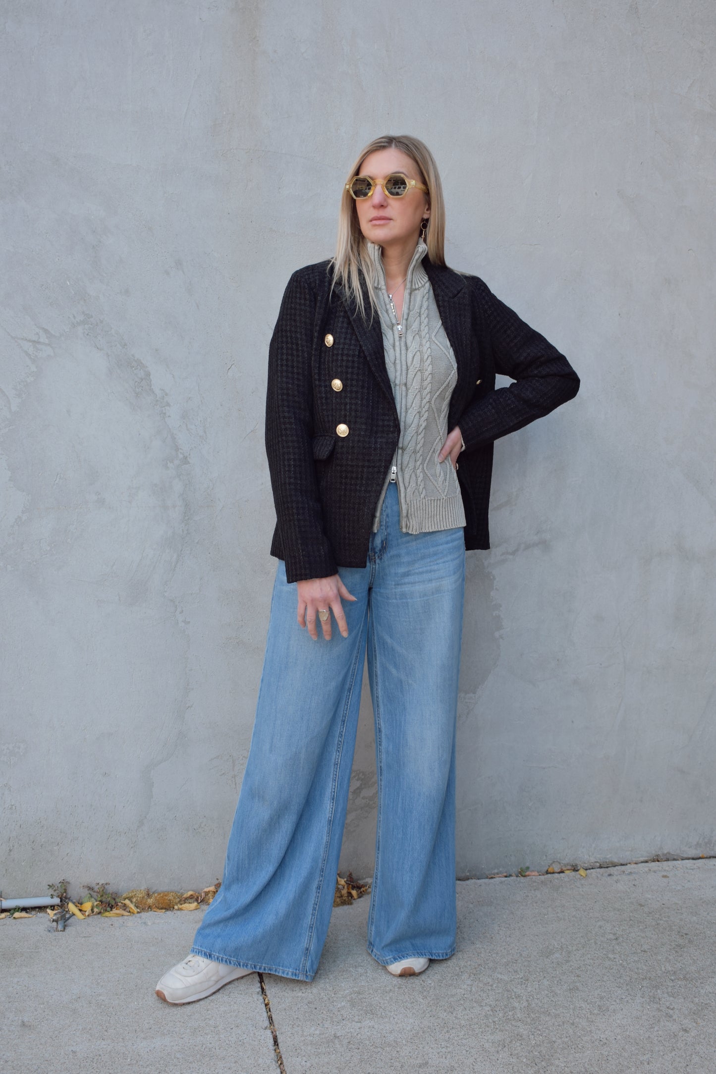 black tweed blazer with flap enclosure front pockets, gold sailor buttons, double breasted, notched front hem, slim fit, full length