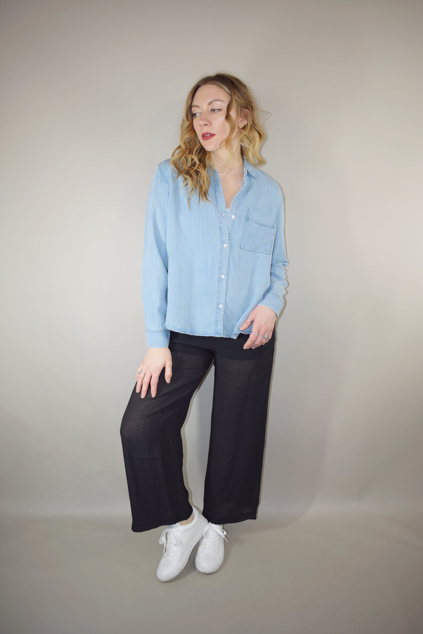 Tencel light wash denim long sleeve button down with one breast patch pocket full length