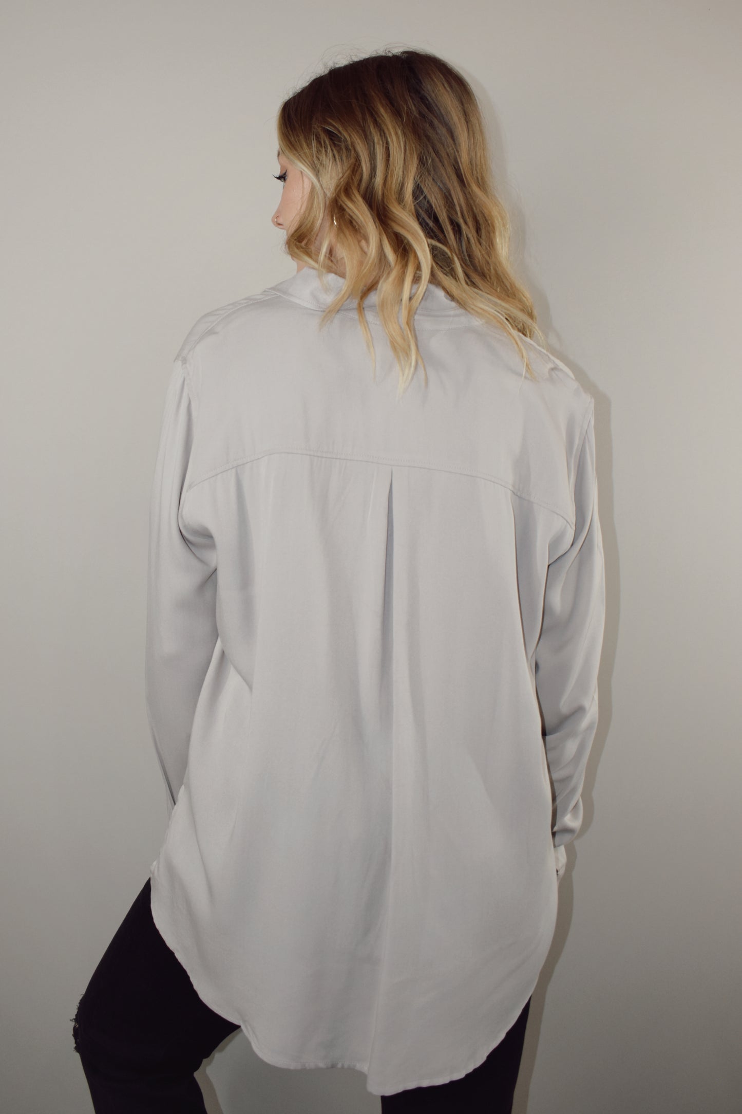 long sleeve full length button down with one patch breast pocket slits along sides on hem 