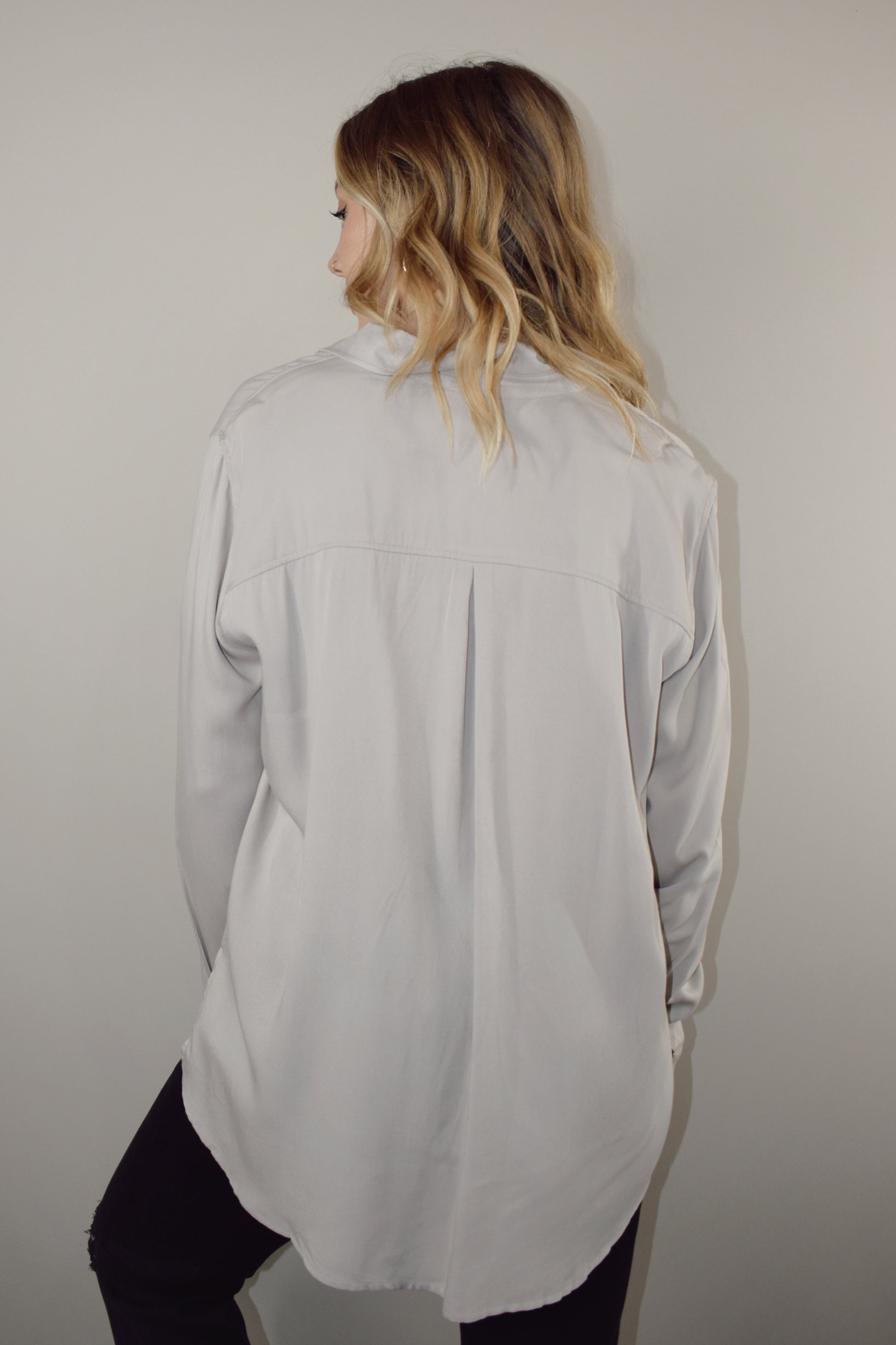 long sleeve full length button down with one patch breast pocket slits along sides on hem 