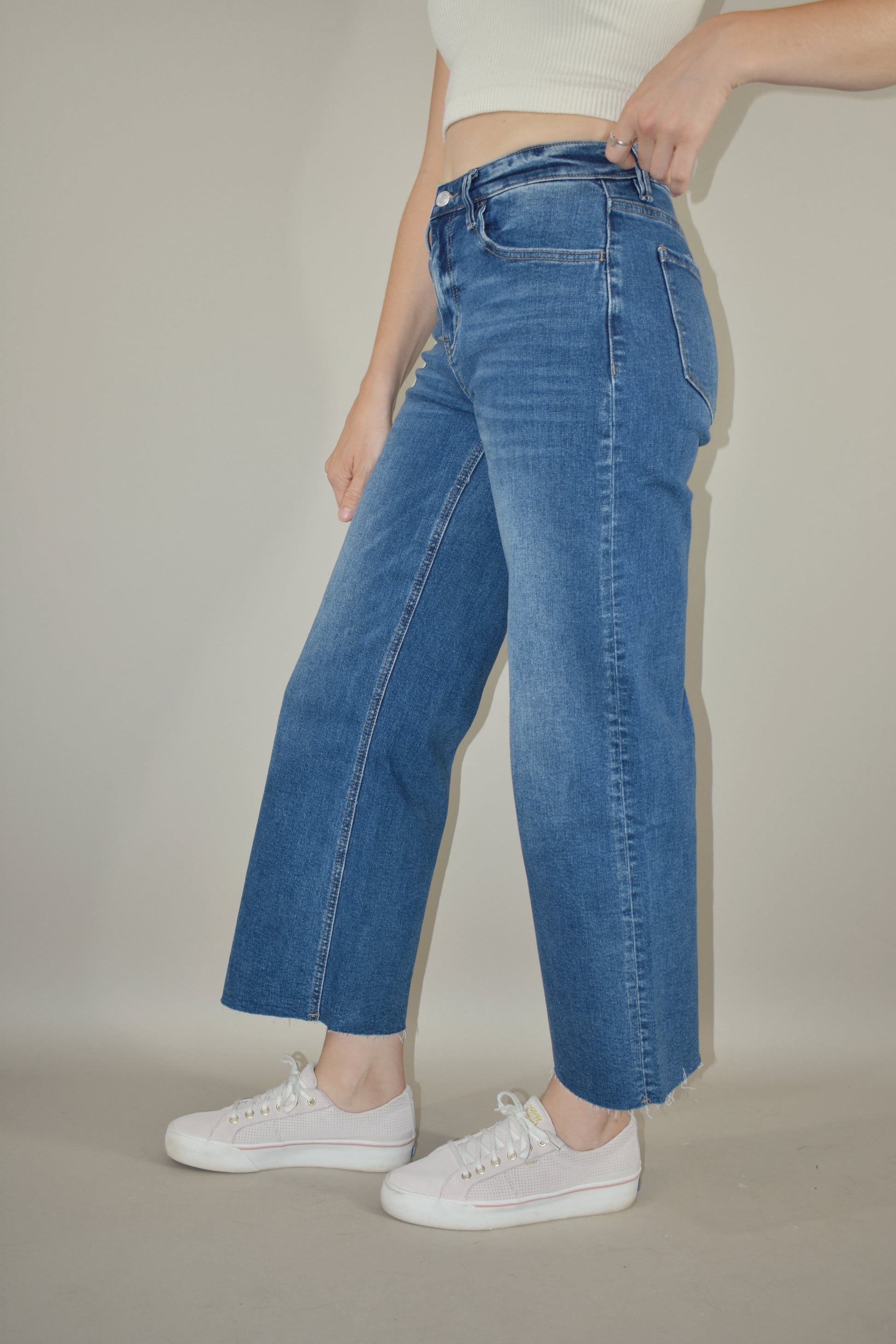 high rise wide leg cropped medium wash stretch denim jeans no holes raw hem