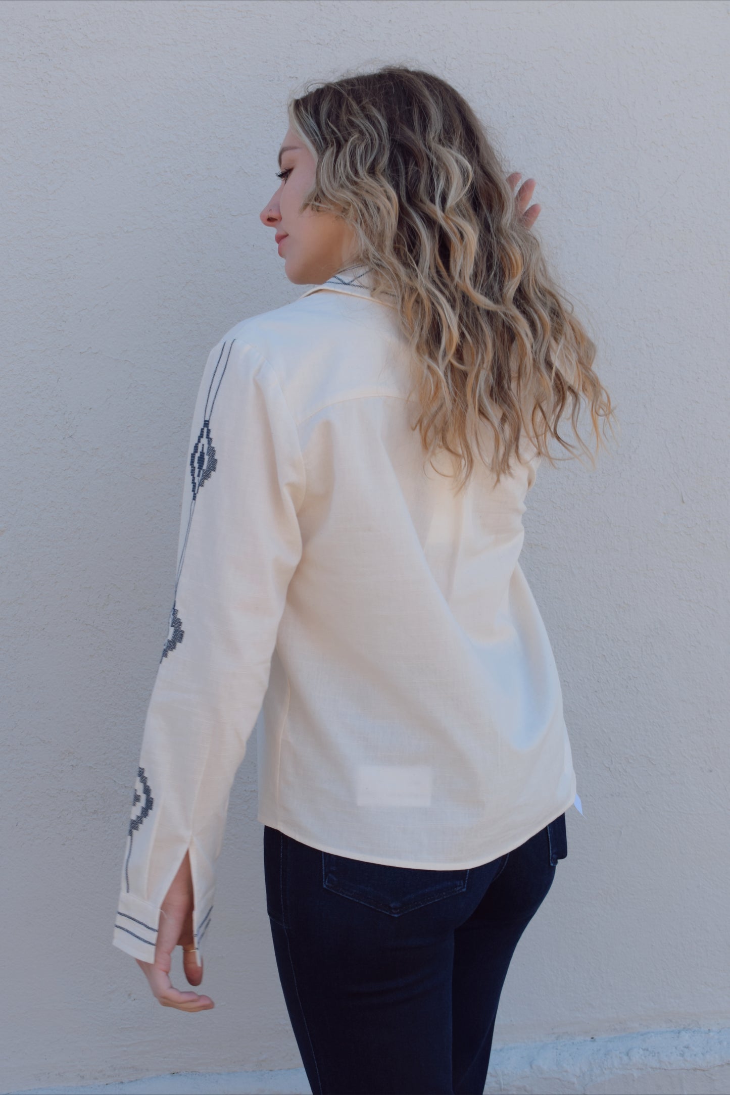 ivory button down full length with denim blue embroidery details along front, down sleeves, collar and cuffs. button cuffs, straight relaxed fit